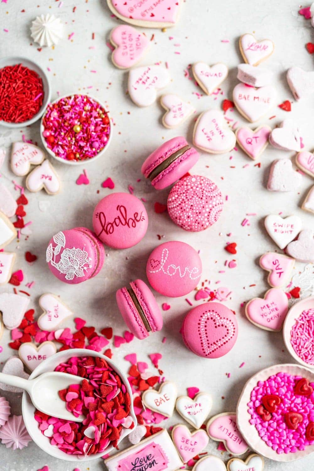macarons on surface painted with valentine's images