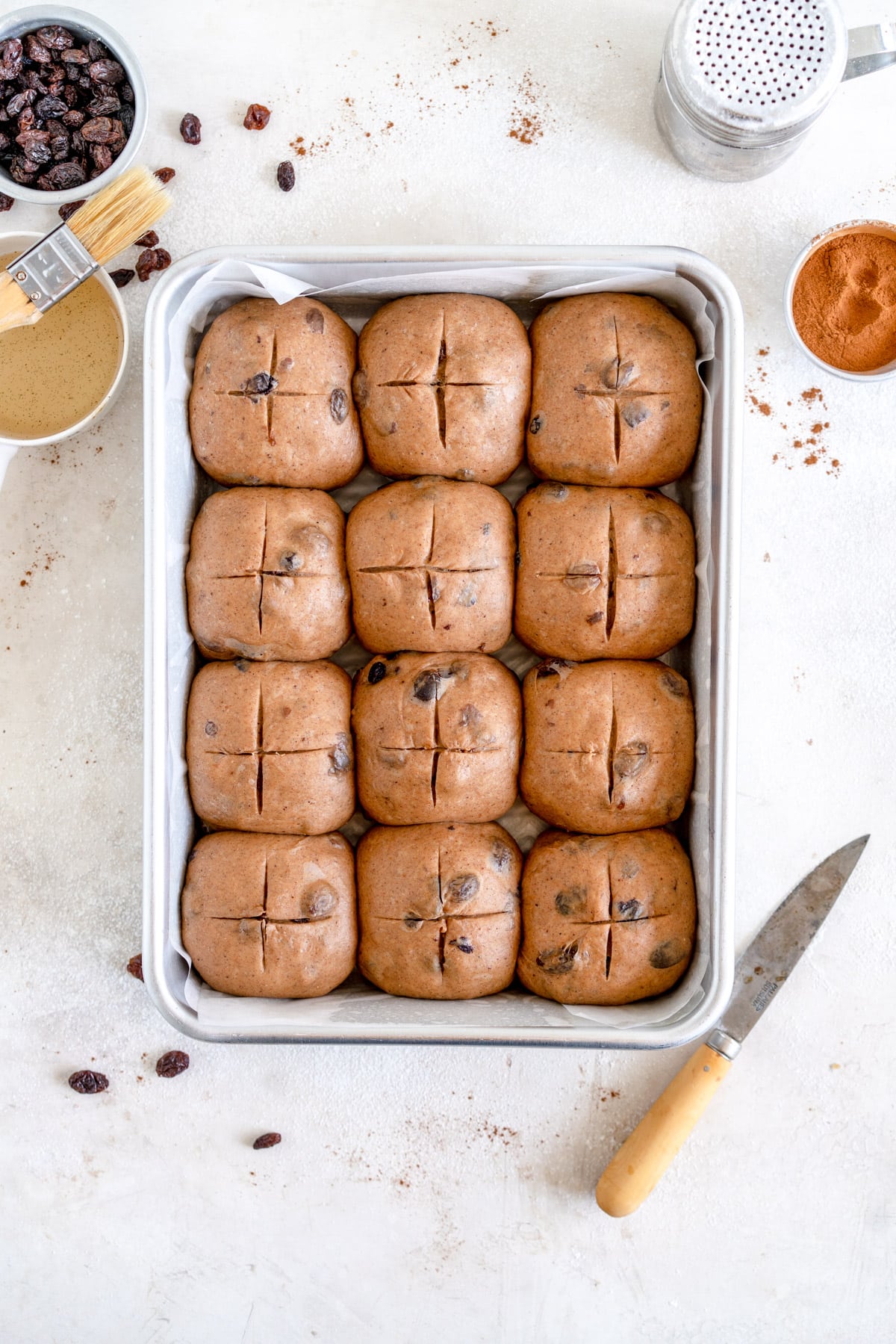 hot cross buns ready for the oven
