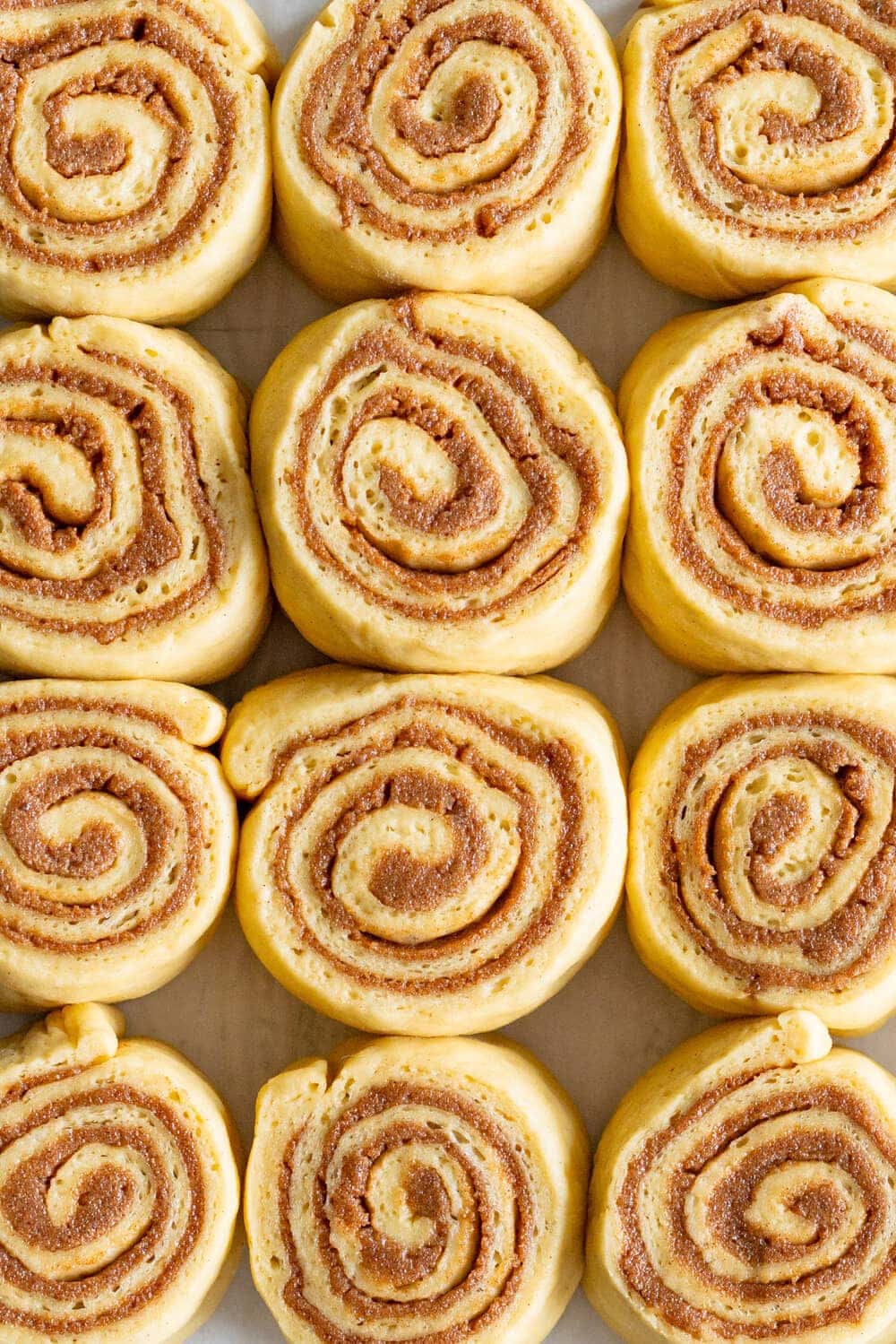 close up shot of brown butter cinnamon rolls ready for the oven