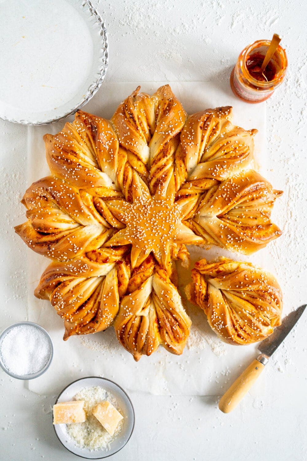 Pesto Star bread on surface with knife