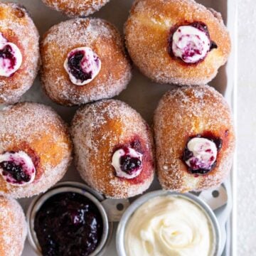 Doughnuts on a pan with cheesecake and blueberry filling