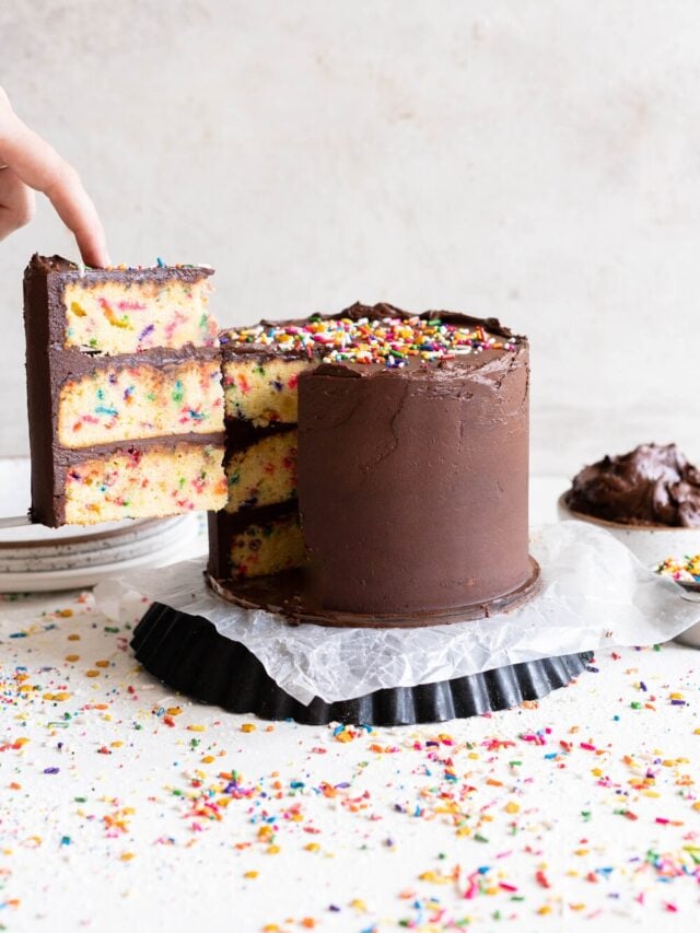 The most delicious, moist funfetti vanilla bean cake. This homemade funfetti cake has a yellow cake base and is made with buttermilk to keep it perfectly dense, and is packed full of Jimmy sprinkles. The confetti cake is layered with a rich chocolate American Buttercream frosting, and finished with more sprinkles. This is the perfect celebration cake, and at six inches it is great for a small group.