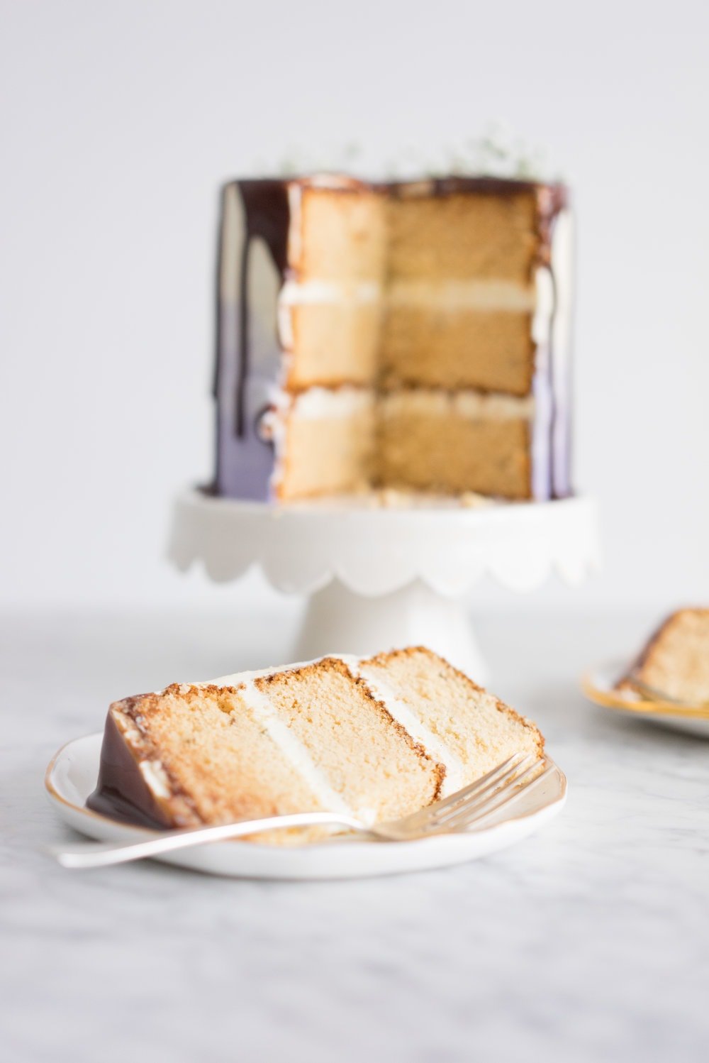 Honey lavender cake with vanilla german buttercream and lavender chocolate ganache drip