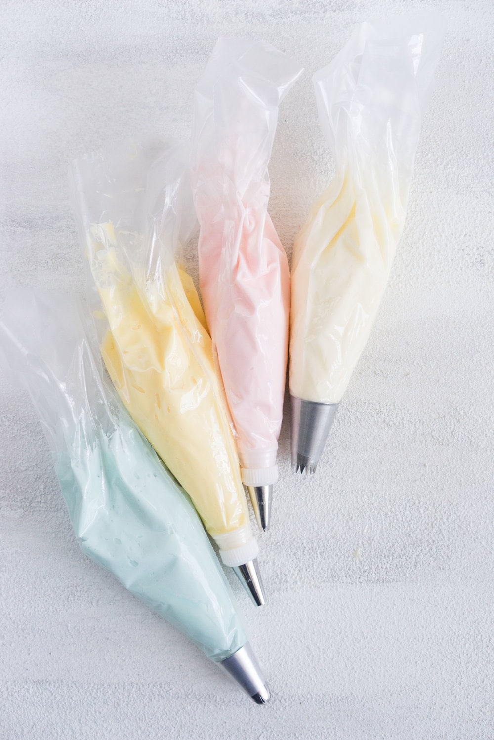 Carrot Cake with cream cheese icing that is super easy to pipe. The cake is moist and flavourful, and the icing has the perfect amount of sweetness and cream cheese punch.