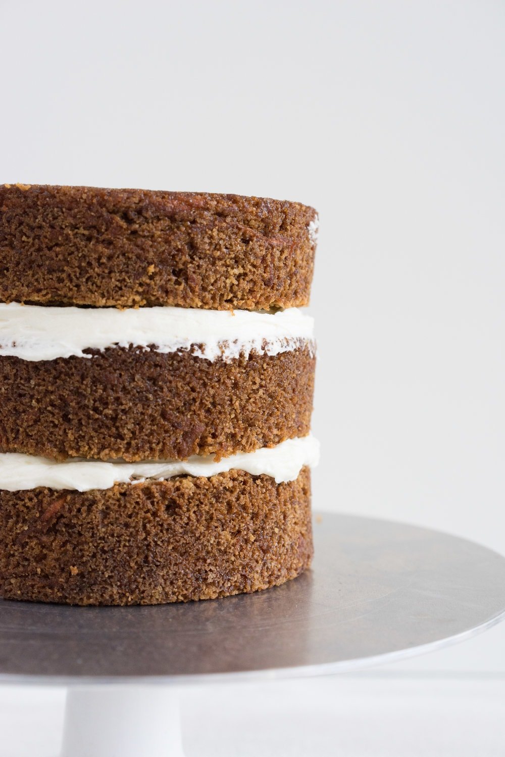 Carrot Cake with cream cheese icing that is super easy to pipe. The cake is moist and flavourful, and the icing has the perfect amount of sweetness and cream cheese punch.