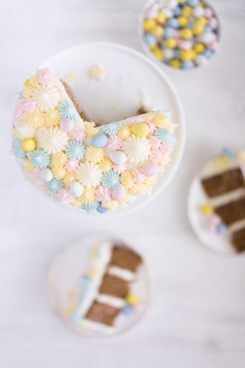 Carrot Cake with cream cheese icing that is super easy to pipe. The cake is moist and flavourful, and the icing has the perfect amount of sweetness and cream cheese punch.