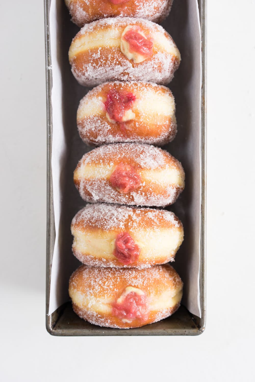 Brioche doughnuts, roasted rhubarb, vanilla bean pastry cream, and vanilla sugar