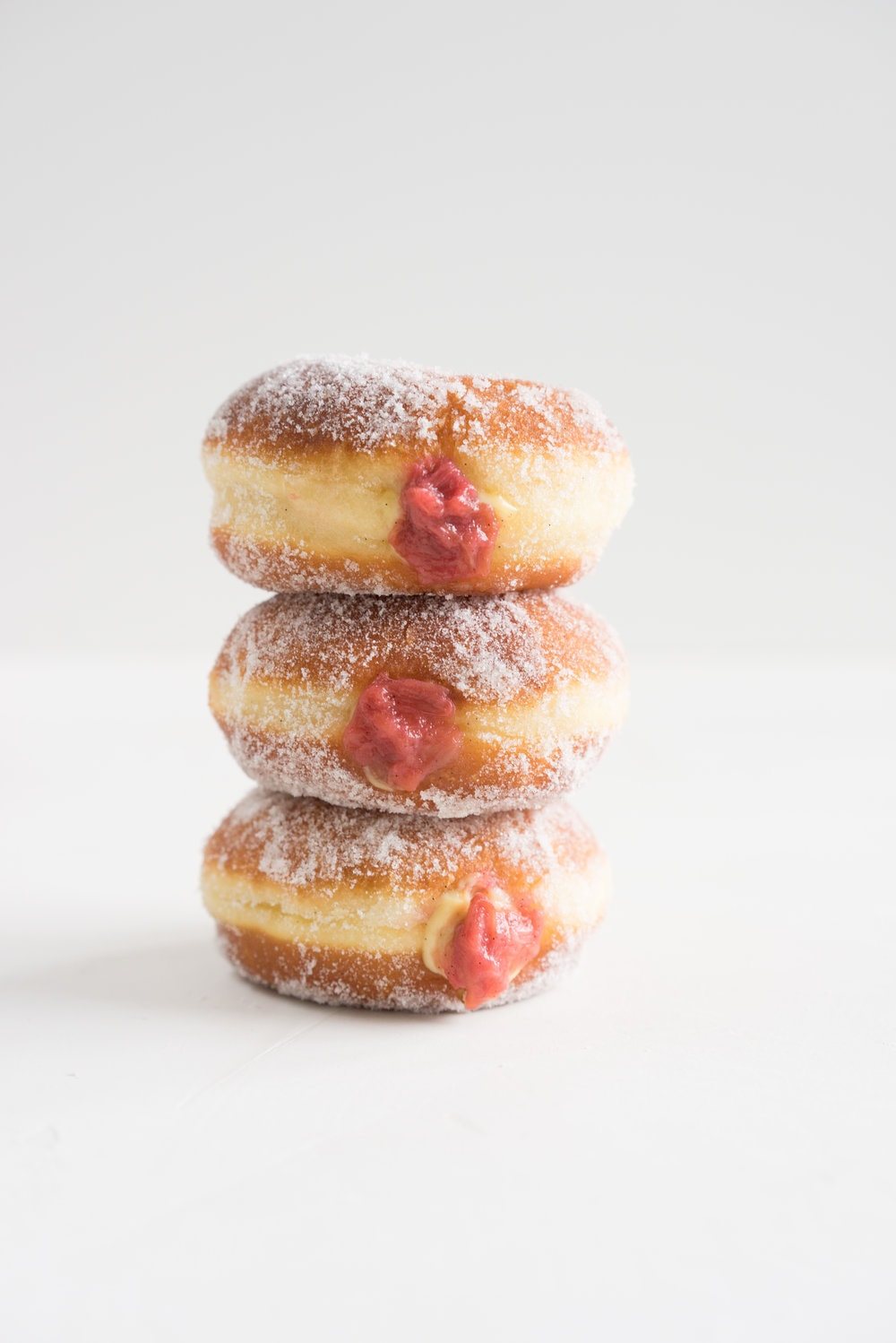 Brioche doughnuts, roasted rhubarb, vanilla bean pastry cream, and vanilla sugar