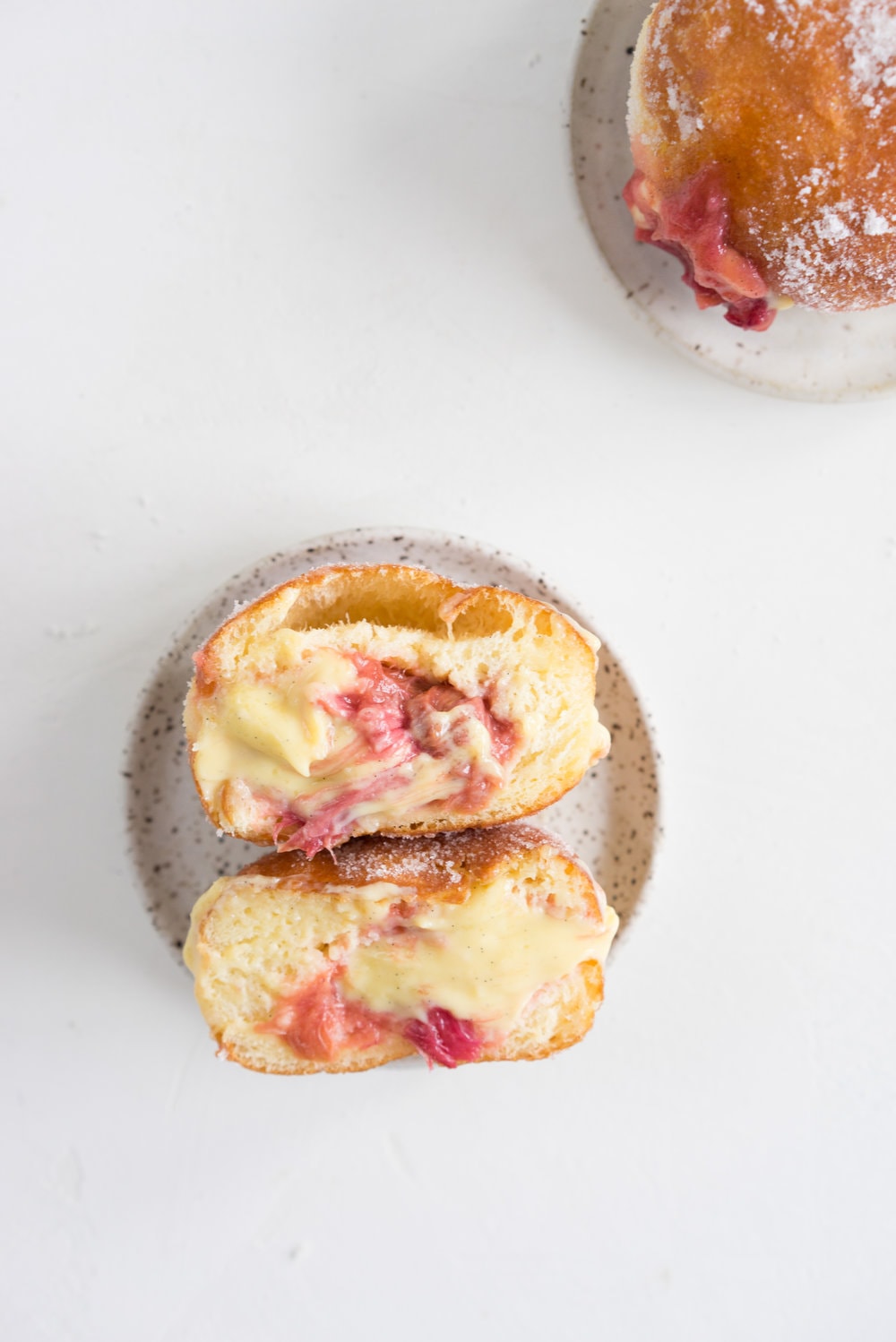 Brioche doughnuts, roasted rhubarb, vanilla bean pastry cream, and vanilla sugar