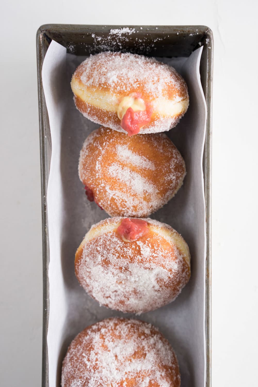 Brioche doughnuts, roasted rhubarb, vanilla bean pastry cream, and vanilla sugar