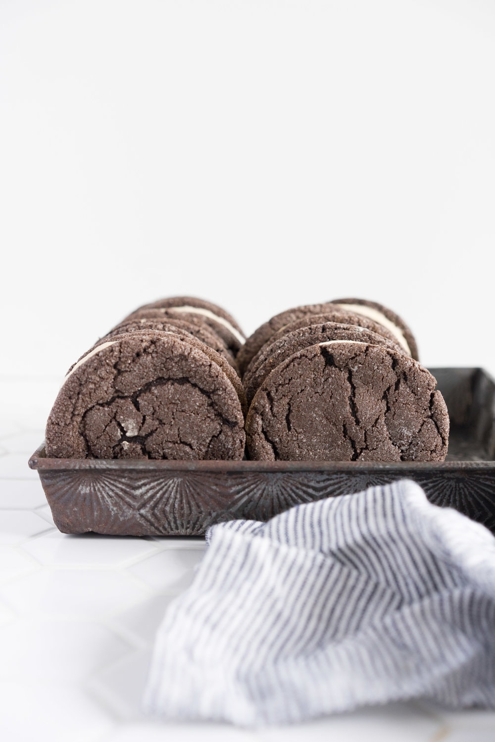 Chocolate earl grey ice cream sandwiches - creamy earl grey ice cream sandwiched between perfectly chewy chocolate sugar cookies. The dessert you never knew you needed. Until now.