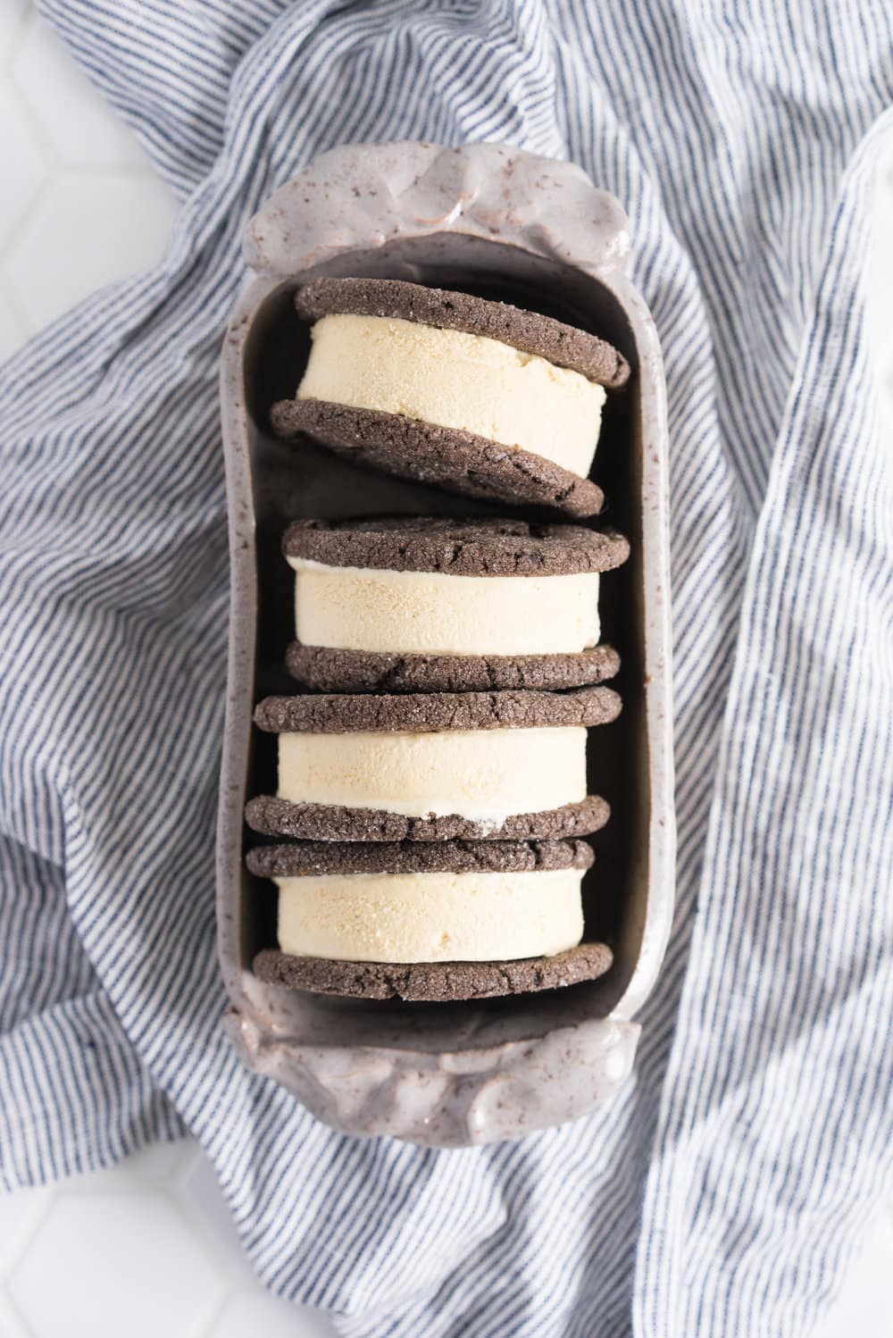 Chocolate earl grey ice cream sandwiches - creamy earl grey ice cream sandwiched between perfectly chewy chocolate sugar cookies. The dessert you never knew you needed. Until now.