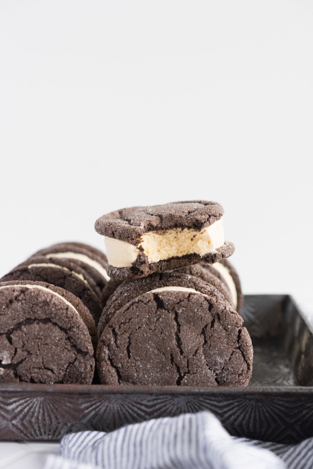 Chocolate earl grey ice cream sandwiches - creamy earl grey ice cream sandwiched between perfectly chewy chocolate sugar cookies. The dessert you never knew you needed. Until now.
