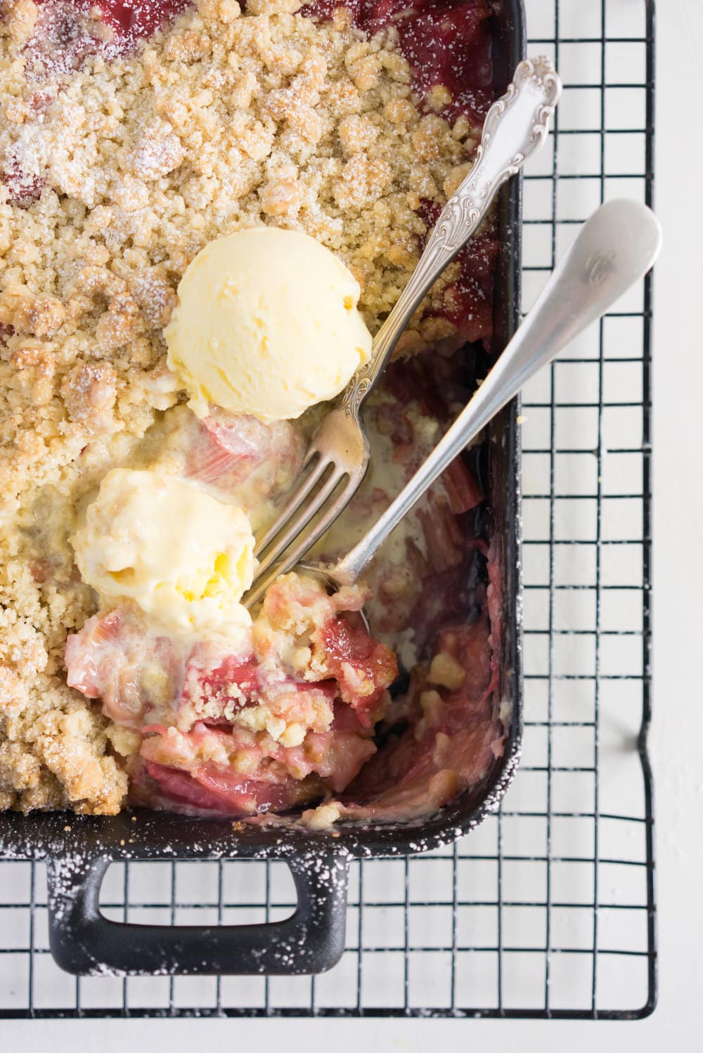 Rhubarb almond crumble with kaffir lime ice cream - the perfect way to hero rhubarb. A super simple summer dessert that can easily be adapted to use your favourite fruit. Paired with a delicately flavoured kaffir lime ice cream, this is the ultimate comfort food.