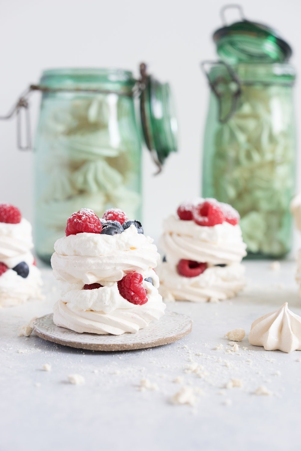 Meringue stacks with vanilla bean mascarpone whipped cream and fresh berries. The perfect, simple, throw together dessert that can be easily made ahead and is easy to feed a crowd