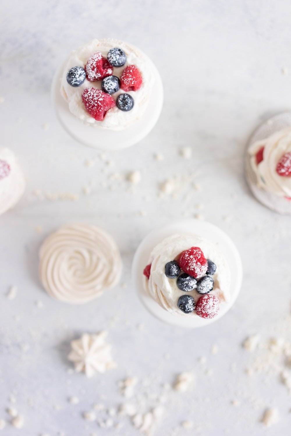 Meringue stacks with vanilla bean mascarpone whipped cream and fresh berries. The perfect, simple, throw together dessert that can be easily made ahead and is easy to feed a crowd