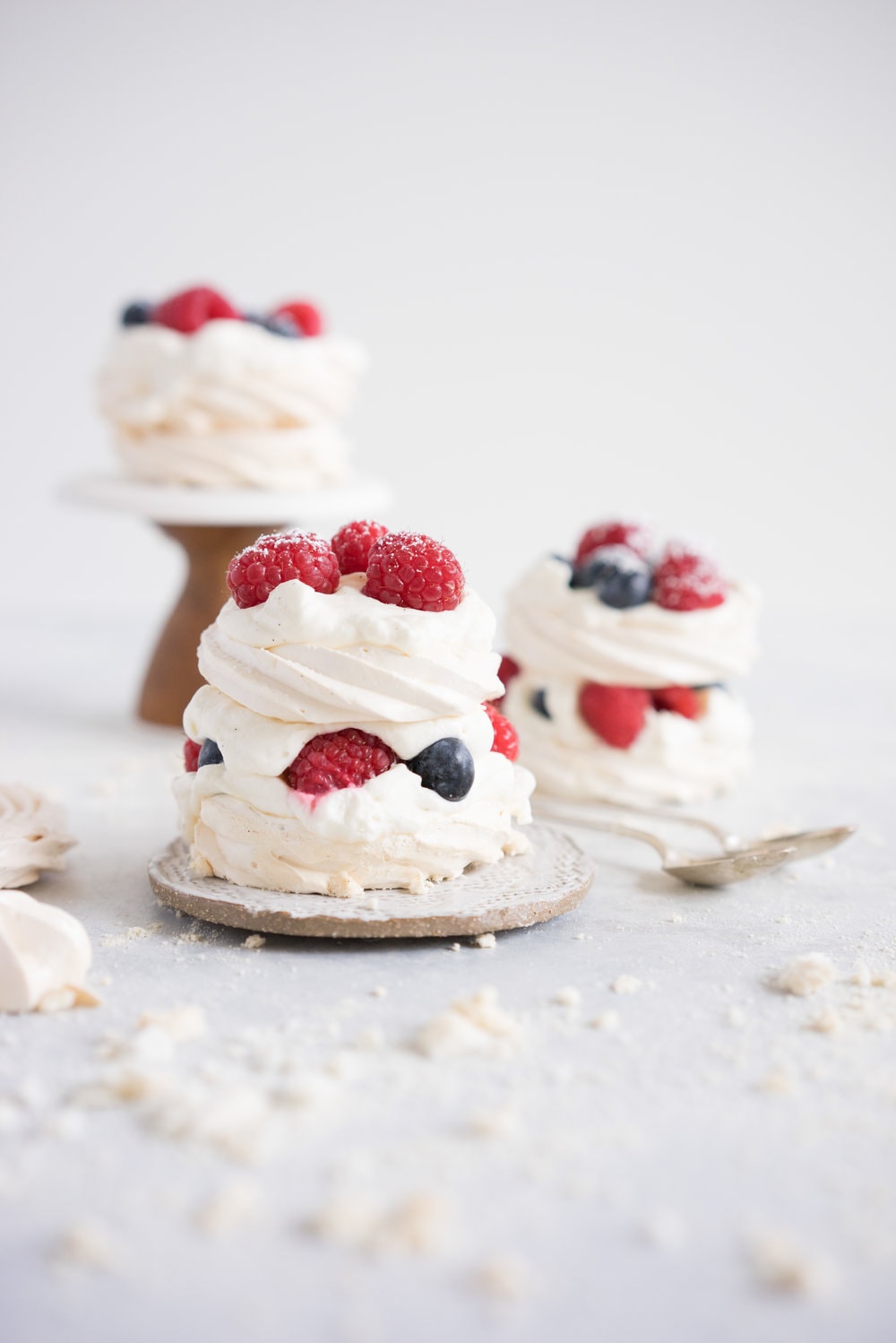 Meringue stacks with vanilla bean mascarpone whipped cream and fresh berries. The perfect, simple, throw together dessert that can be easily made ahead and is easy to feed a crowd