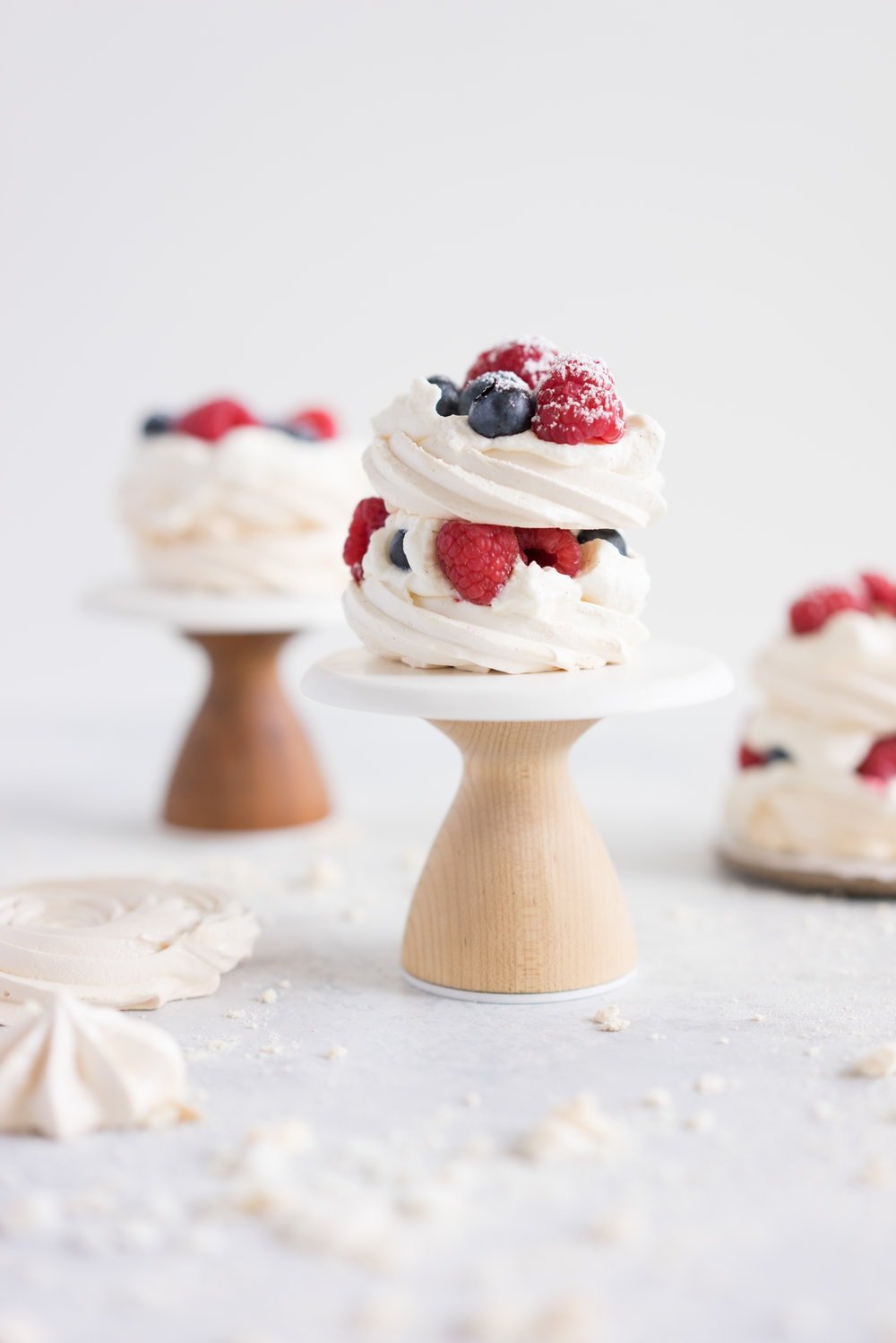 Meringue stacks with vanilla bean mascarpone whipped cream and fresh berries. The perfect, simple, throw together dessert that can be easily made ahead and is easy to feed a crowd