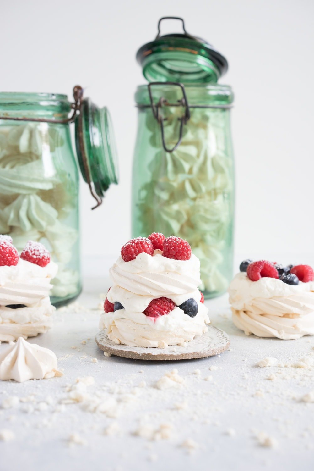Meringue stacks with vanilla bean mascarpone whipped cream and fresh berries. The perfect, simple, throw together dessert that can be easily made ahead and is easy to feed a crowd