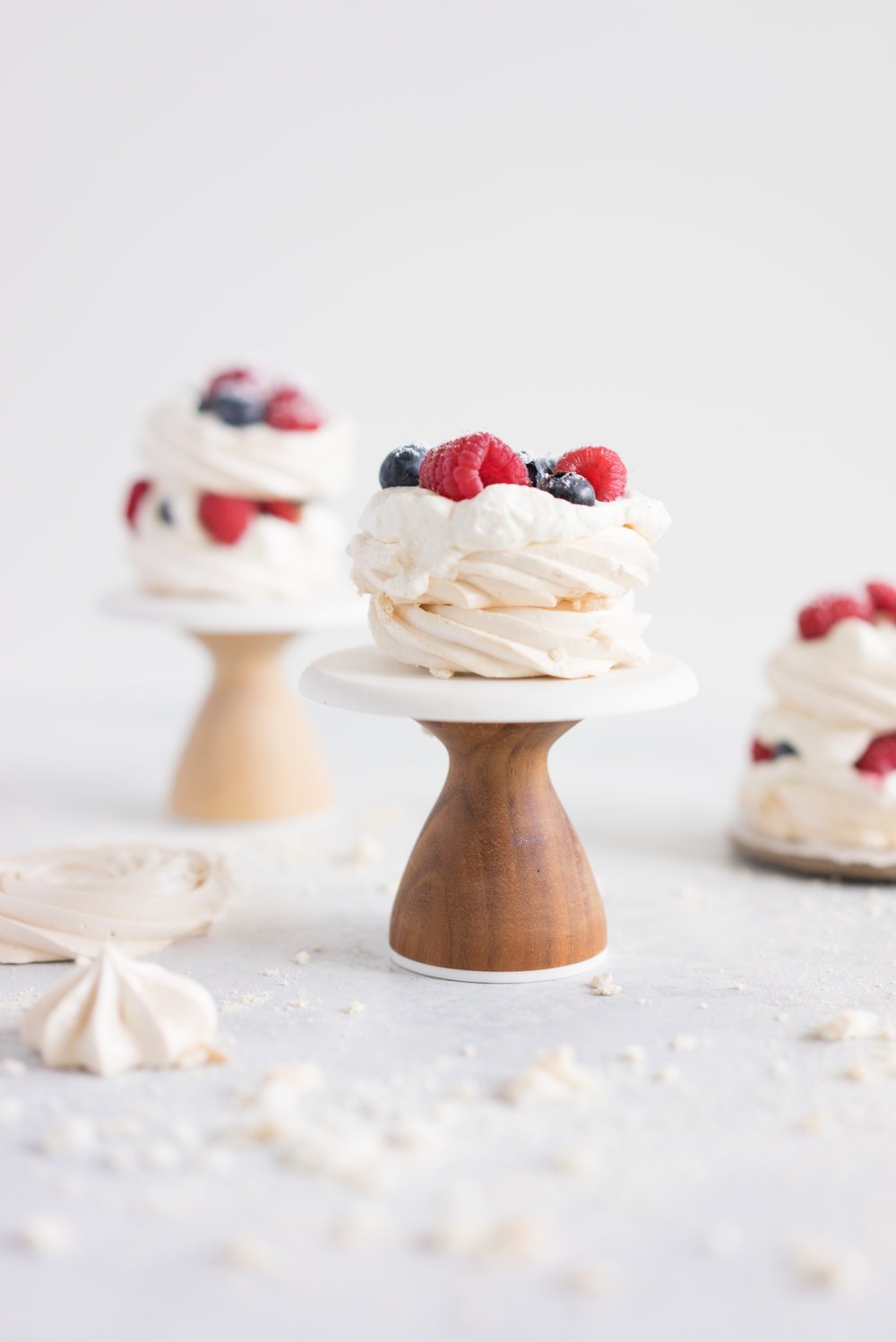 Meringue stacks with vanilla bean mascarpone whipped cream and fresh berries. The perfect, simple, throw together dessert that can be easily made ahead and is easy to feed a crowd