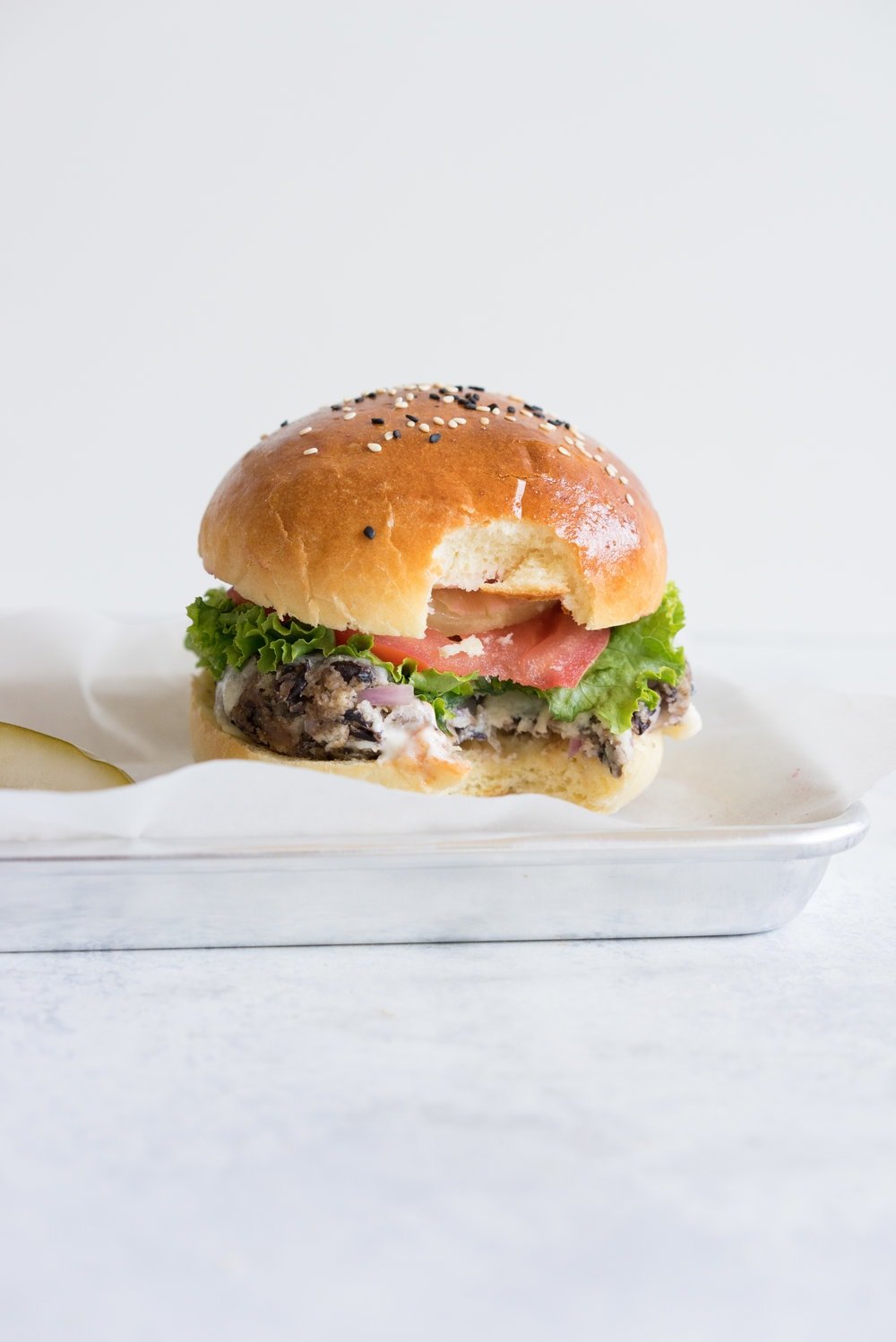 Black bean burgers with homemade brioche burger buns - the perfect vegetarian meal that even the staunchest of hamburger eater will love! #vegetarian #blackbeanburger