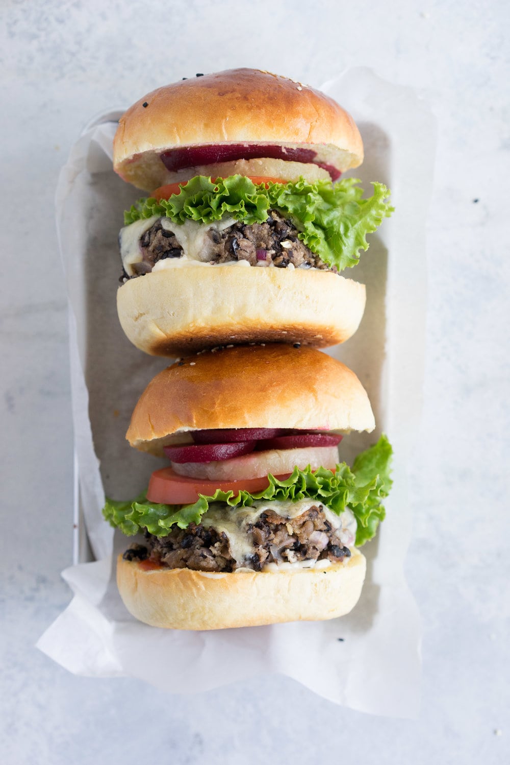 Black bean burgers with homemade brioche burger buns - the perfect vegetarian meal that even the staunchest of hamburger eater will love! #vegetarian #blackbeanburger