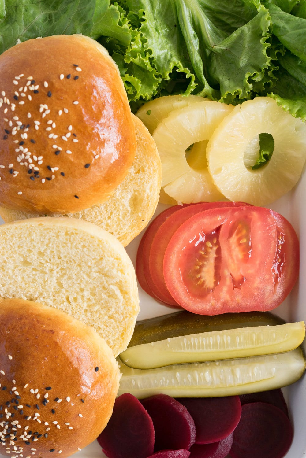 Black bean burgers with homemade brioche burger buns - the perfect vegetarian meal that even the staunchest of hamburger eater will love! #vegetarian #blackbeanburger