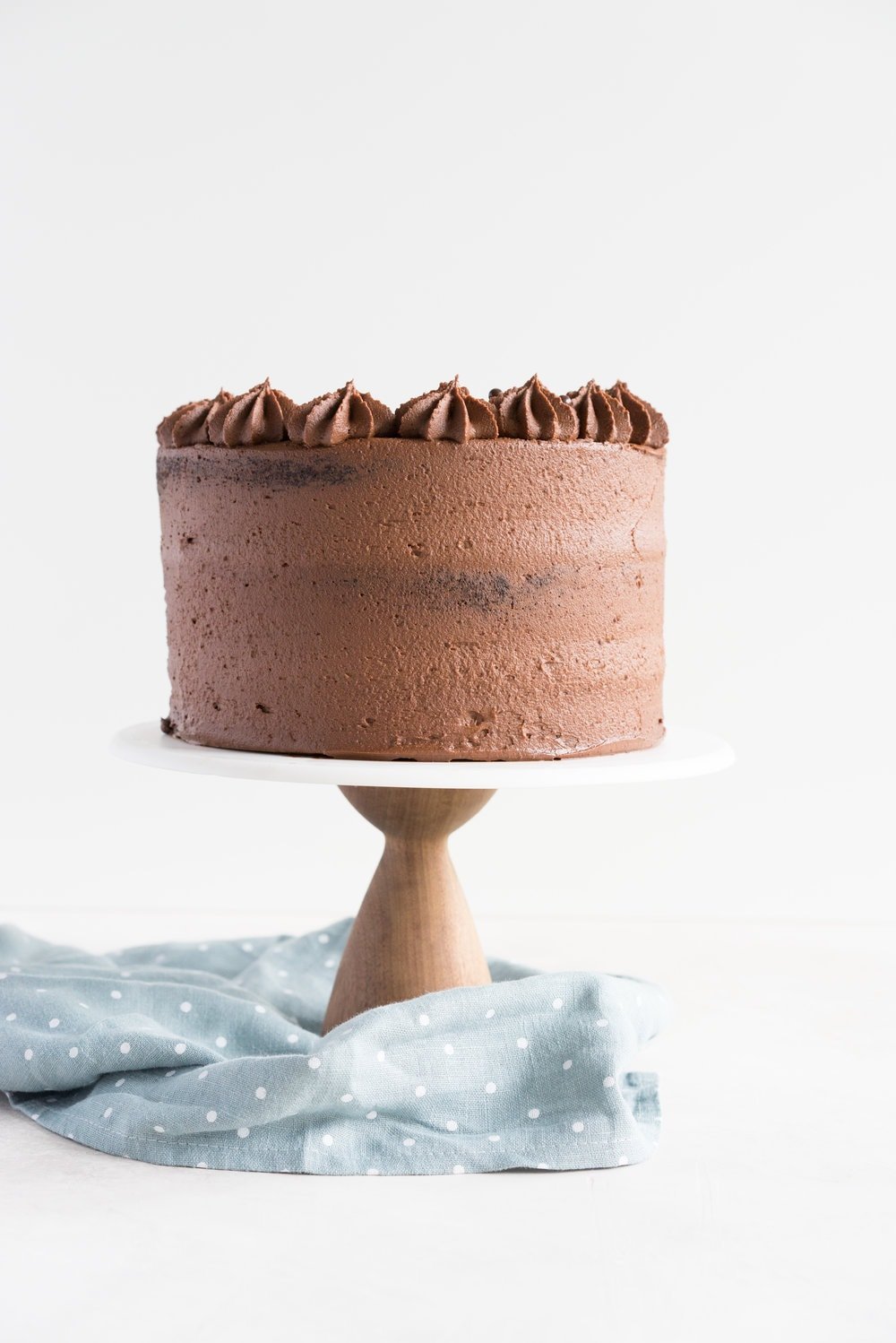 One Bowl Devil's food Layer Cake with Milk Chocolate Frosting - from the new Bravetart book! Dark chocolate cake is prepared in one bowl, baked into perfect layers, then frosted with a smooth, creamy milk chocolate frosting. The ultimate chocolate lover's cake. #devilsfood #layercake #chocolatecake #bravetart #milkchocolate
