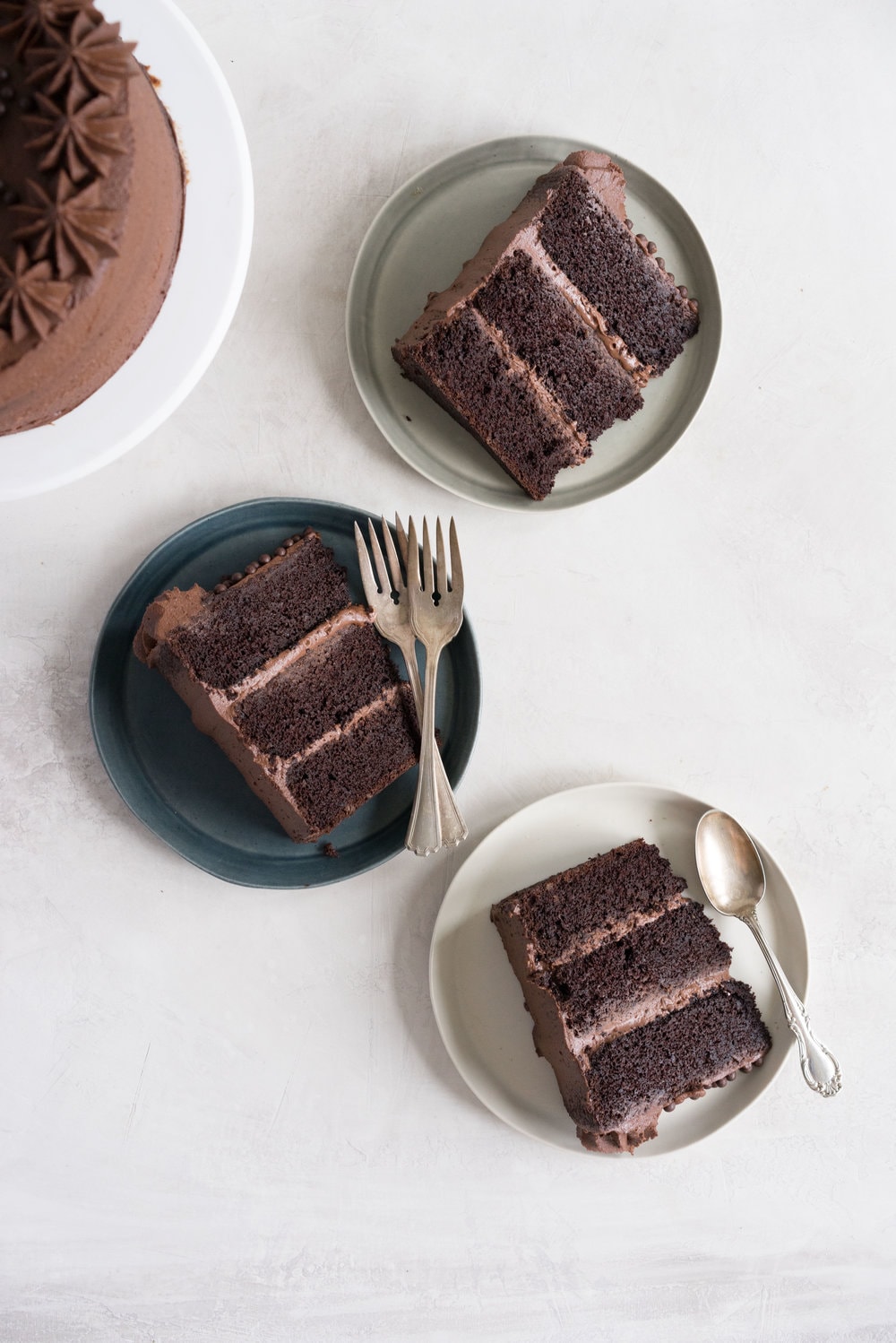 One Bowl Devil's food Layer Cake with Milk Chocolate Frosting - from the new Bravetart book! Dark chocolate cake is prepared in one bowl, baked into perfect layers, then frosted with a smooth, creamy milk chocolate frosting. The ultimate chocolate lover's cake. #devilsfood #layercake #chocolatecake #bravetart #milkchocolate