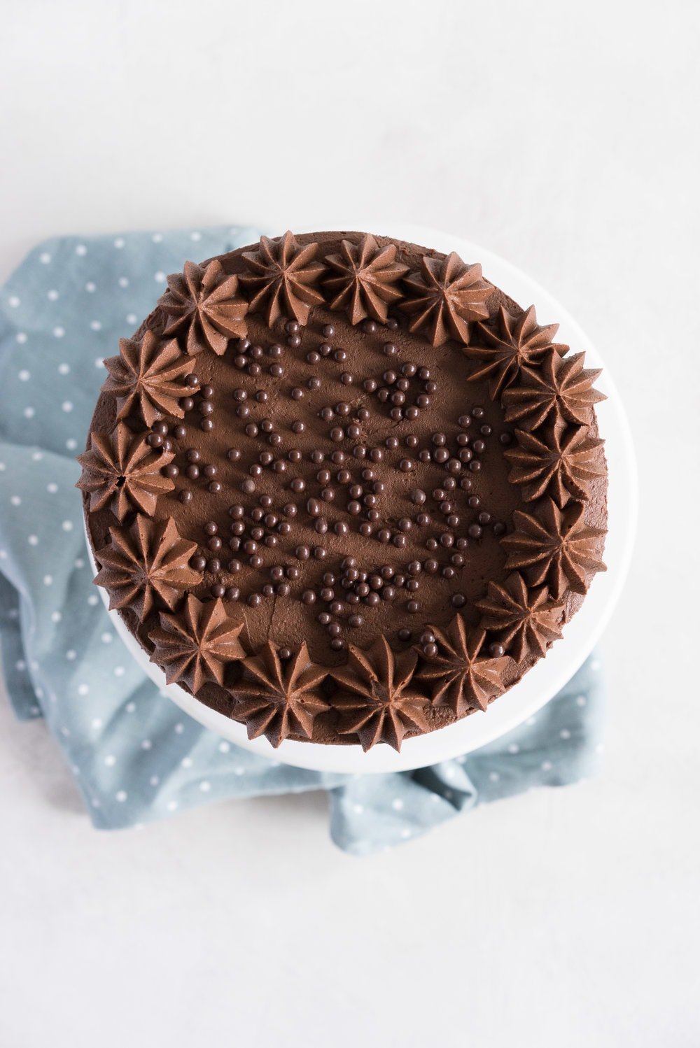 One Bowl Devil's food Layer Cake with Milk Chocolate Frosting - from the new Bravetart book! Dark chocolate cake is prepared in one bowl, baked into perfect layers, then frosted with a smooth, creamy milk chocolate frosting. The ultimate chocolate lover's cake. #devilsfood #layercake #chocolatecake #bravetart #milkchocolate