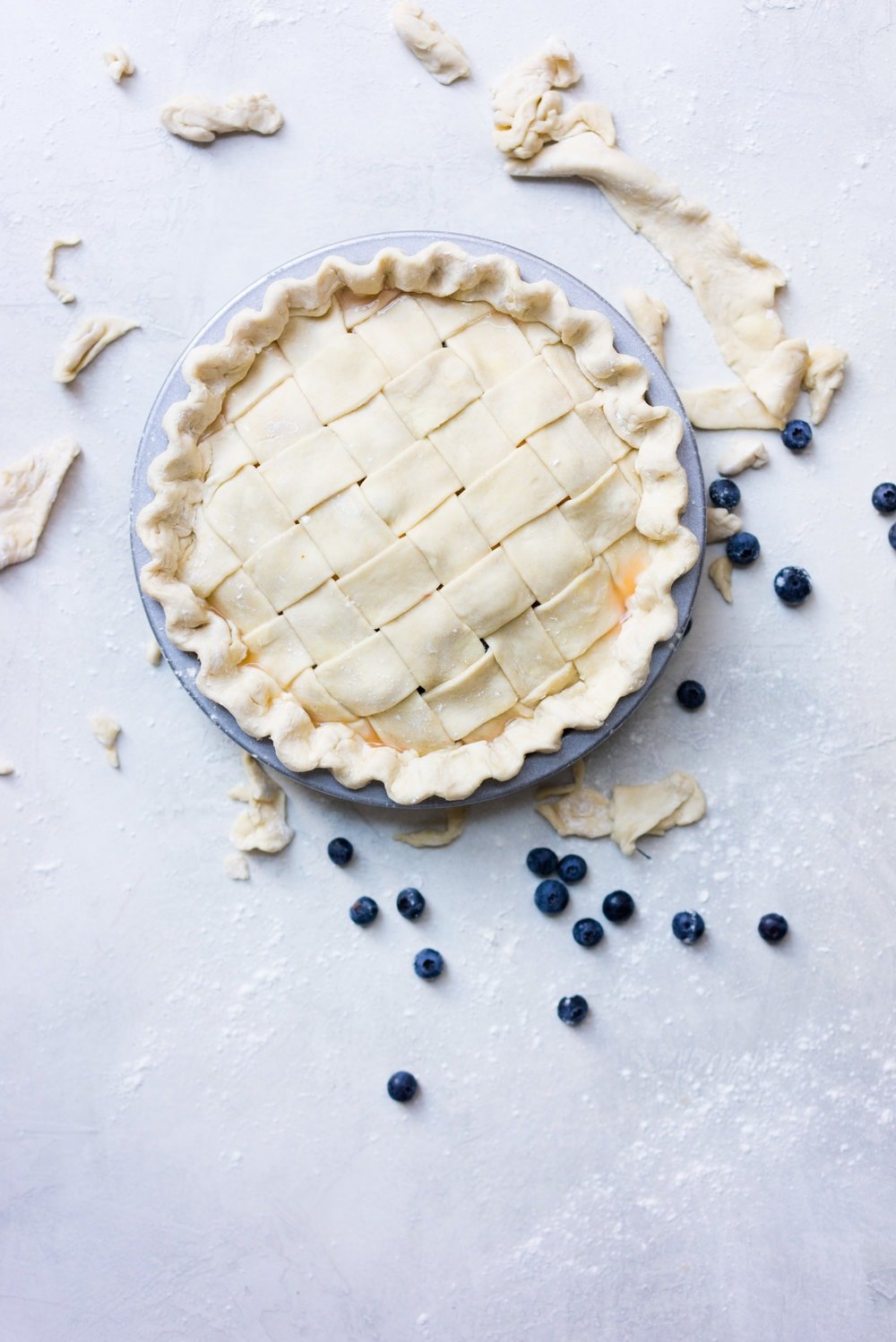 Peach and blueberry pie. The epitome of summer - flavourful fruit, held together in a flaky tender crust, elevated by a touch of sugar. The perfect summer dessert - when you have amazing fruit, you can keep things simple. #peachpie #blueberrypie #homemadepie #fruitpie #piedough #pierecipe #latticepie #peachandblueberrypie