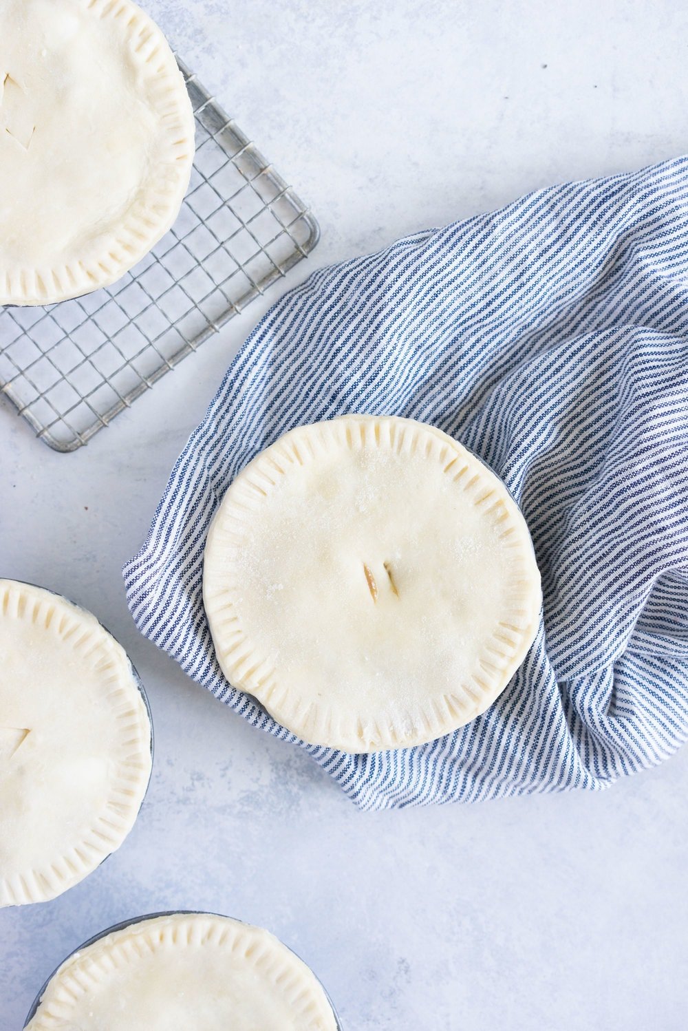 Individual steak and mushroom pies - flaky pastry encases a rich meaty filling with a flavourful gravy