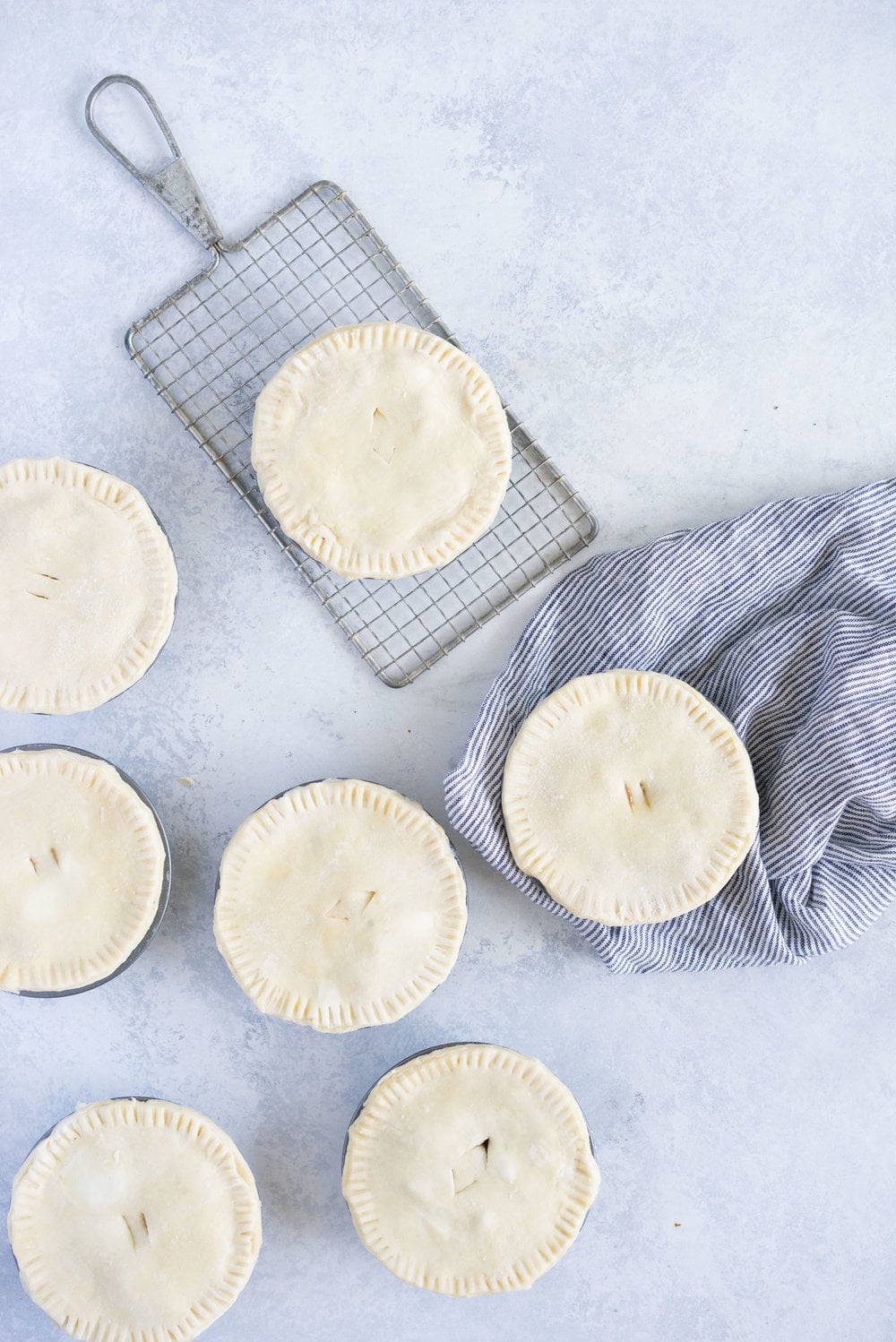 Individual steak and mushroom pies - flaky pastry encases a rich meaty filling with a flavourful gravy