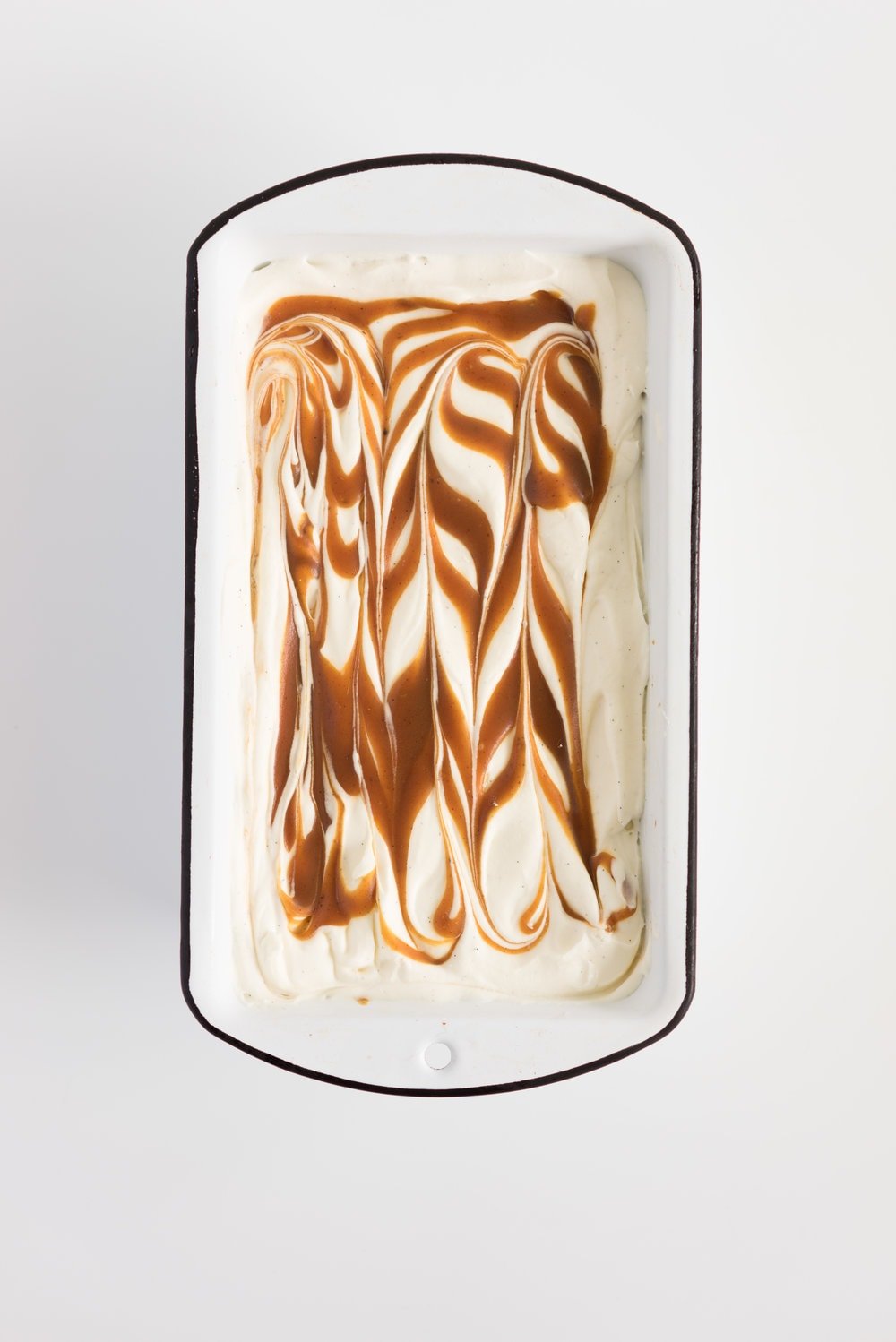 Salted Caramel No churn Ice Cream - creamy vanilla no churn ice cream is swirled with a spiced salted caramel ripple. A fancy wee twist on everyone's favourite no-churn recipe #nochurn #icecream #saltedcaramel #caramel #vanilla #nochurn