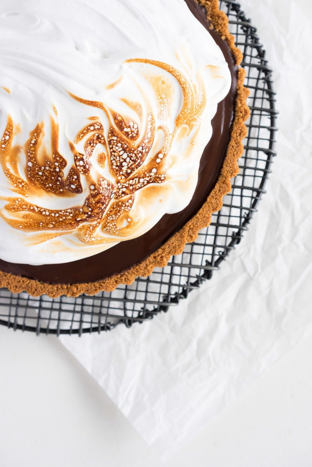 S'mores tart - brown butter graham cracker crust, silky chocolate ganache filling, and toasty vanilla bean marshmallow. #tart #chocolatetart #s'morestart #grahamcracker #smorestart #brownbutter #chocolateganache