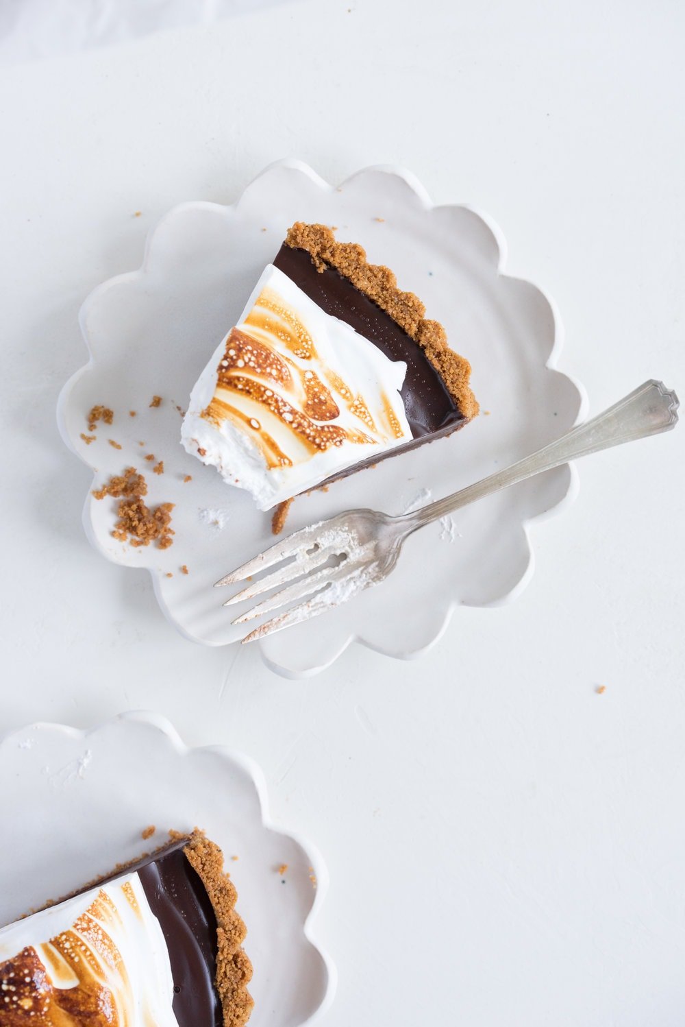 S'mores tart - brown butter graham cracker crust, silky chocolate ganache filling, and toasty vanilla bean marshmallow. #tart #chocolatetart #s'morestart #grahamcracker #smorestart #brownbutter #chocolateganache
