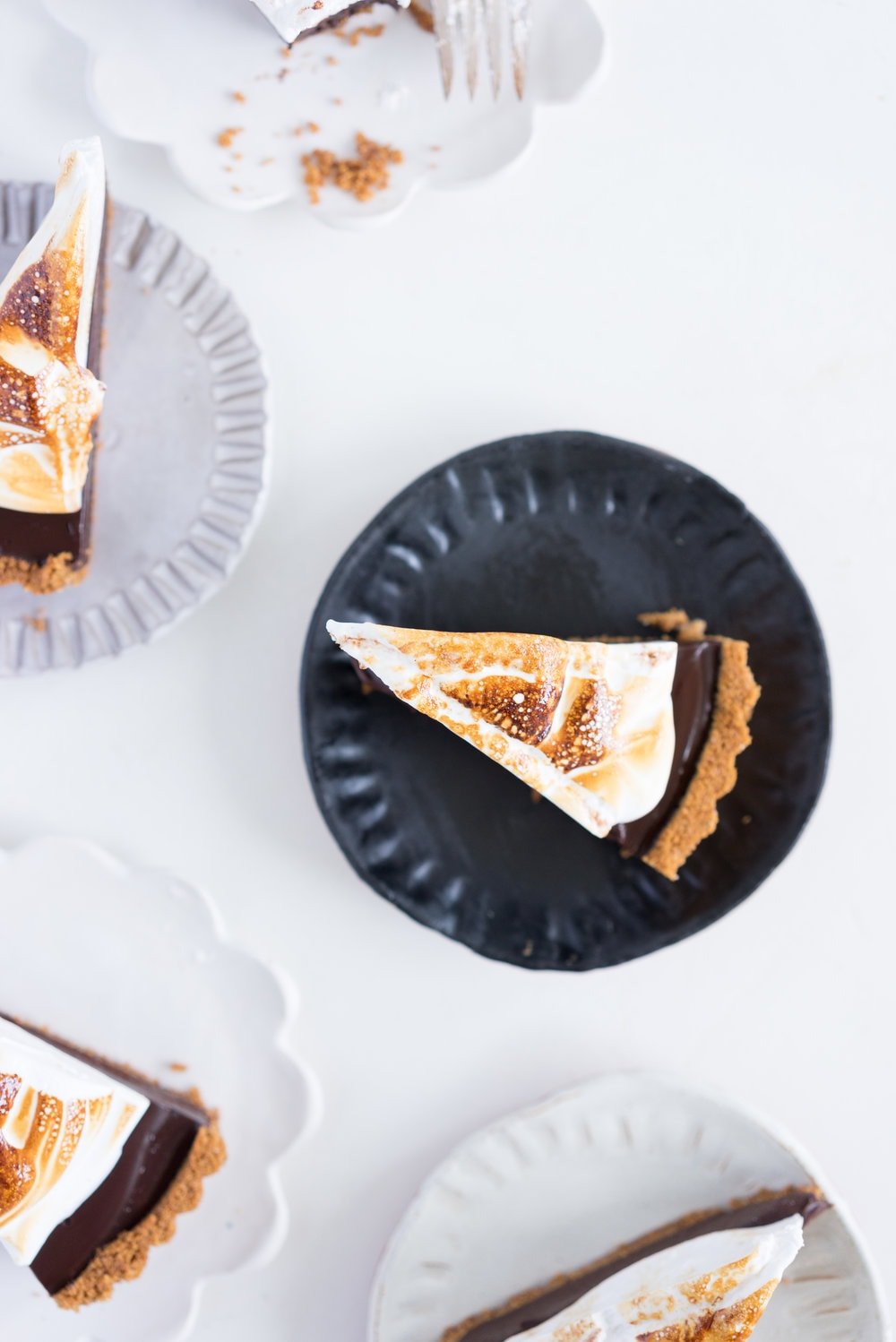 S'mores tart - brown butter graham cracker crust, silky chocolate ganache filling, and toasty vanilla bean marshmallow. #tart #chocolatetart #s'morestart #grahamcracker #smorestart #brownbutter #chocolateganache