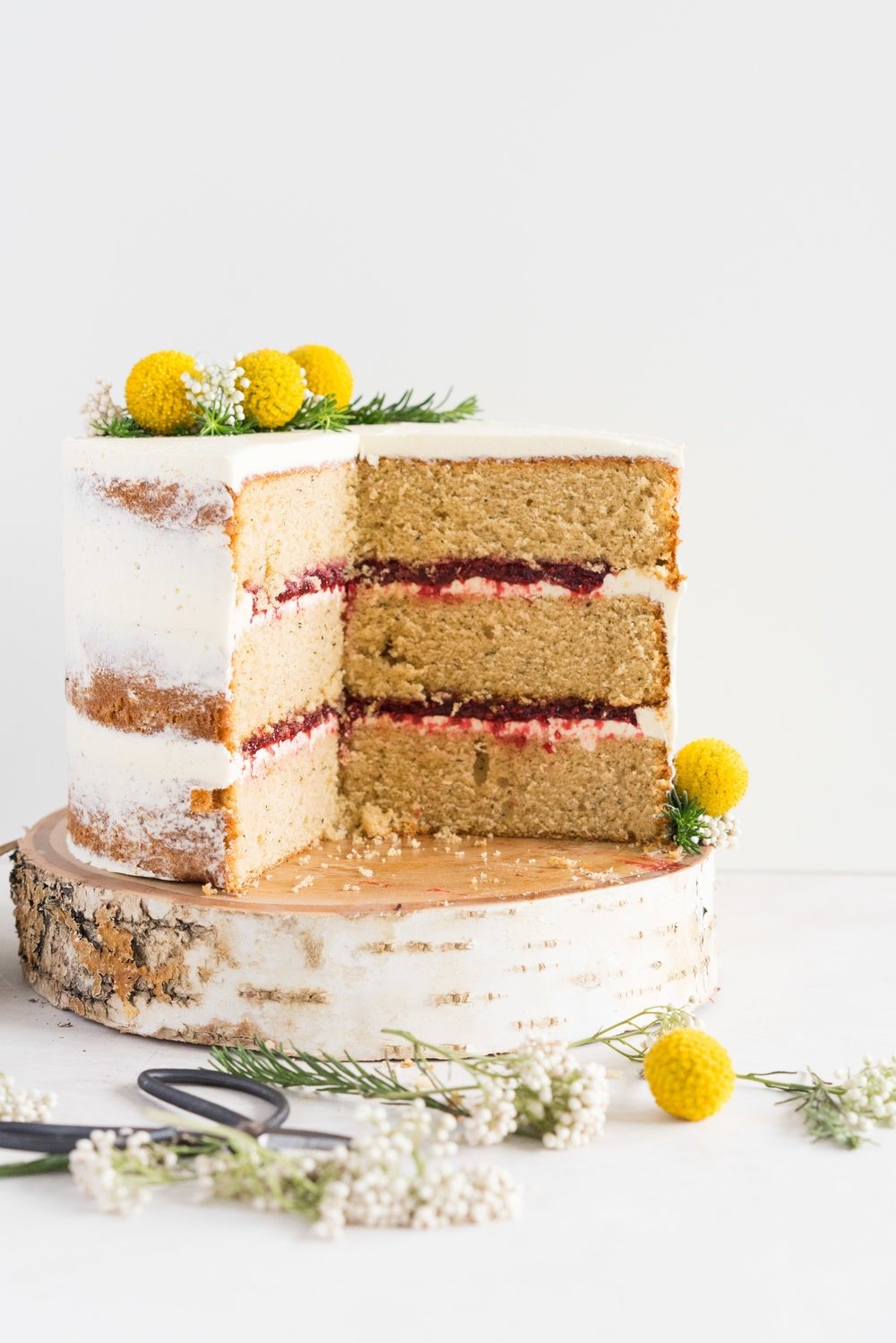 Earl Grey Cake with Raspberry Filling and Vanilla German Buttercream - A delicate earl grey infused cake, filled with a tart raspberry filling, and finished with a creamy vanilla bean german buttercream