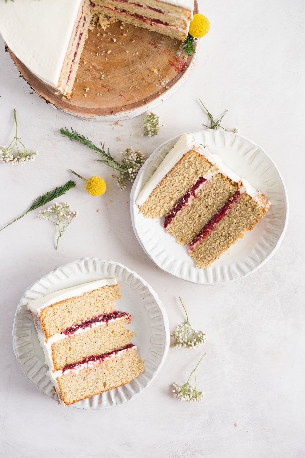 Earl Grey Cake with Raspberry Filling and Vanilla German Buttercream - A delicate earl grey infused cake, filled with a tart raspberry filling, and finished with a creamy vanilla bean german buttercream