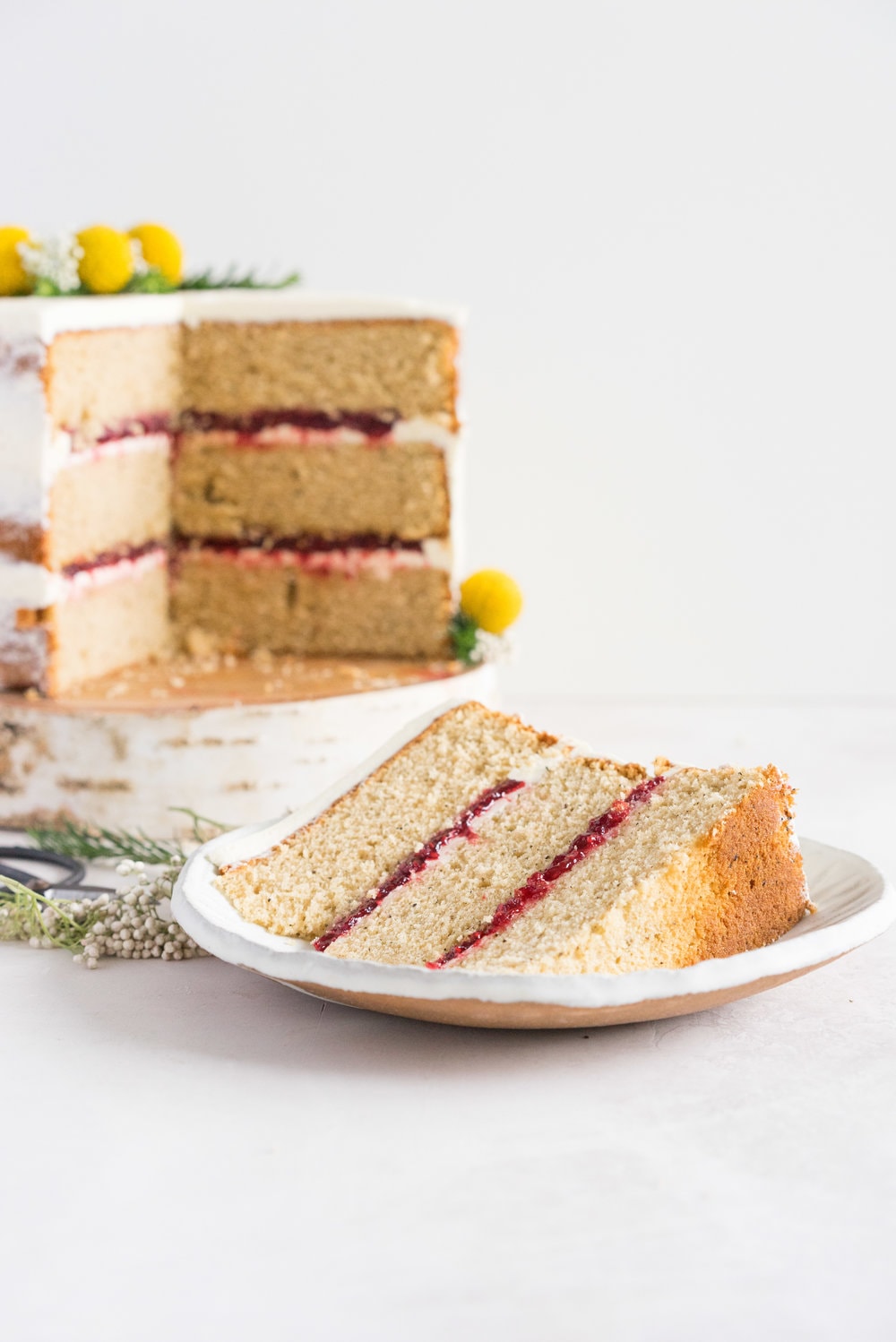 Earl Grey Cake with Raspberry Filling and Vanilla German Buttercream - A delicate earl grey infused cake, filled with a tart raspberry filling, and finished with a creamy vanilla bean german buttercream