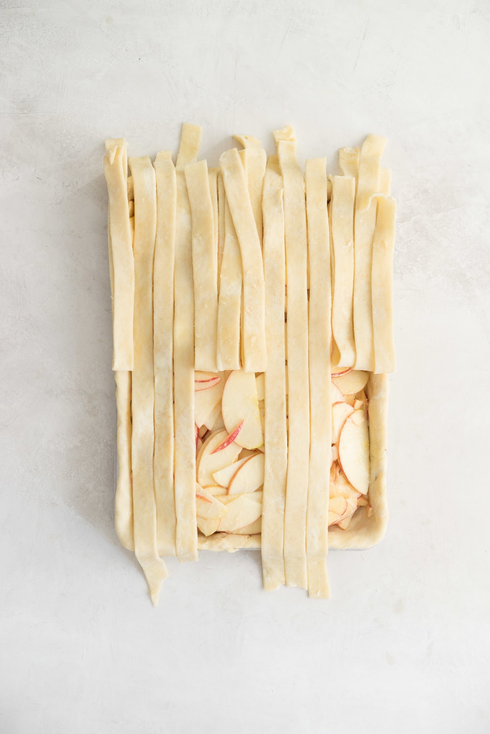 Apple Slab pie - perfect for a crowd, this apple slab pie combines juicy apples and tender flaky pie crust into the perfect make-ahead dessert, perfect for any season