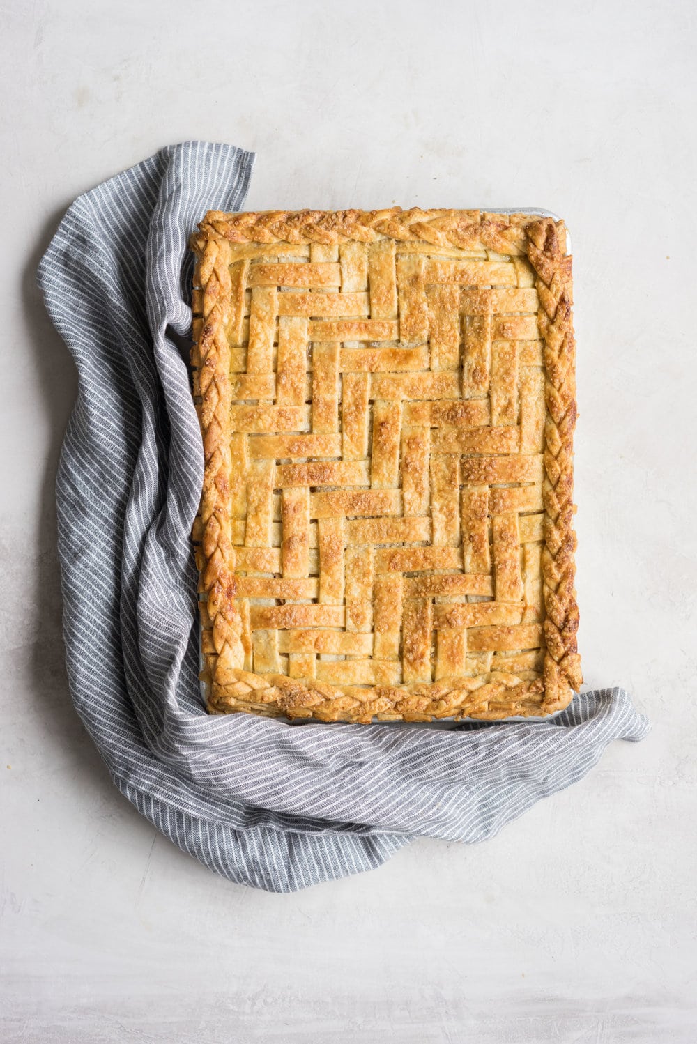 Apple Slab pie - perfect for a crowd, this apple slab pie combines juicy apples and tender flaky pie crust into the perfect make-ahead dessert, perfect for any season