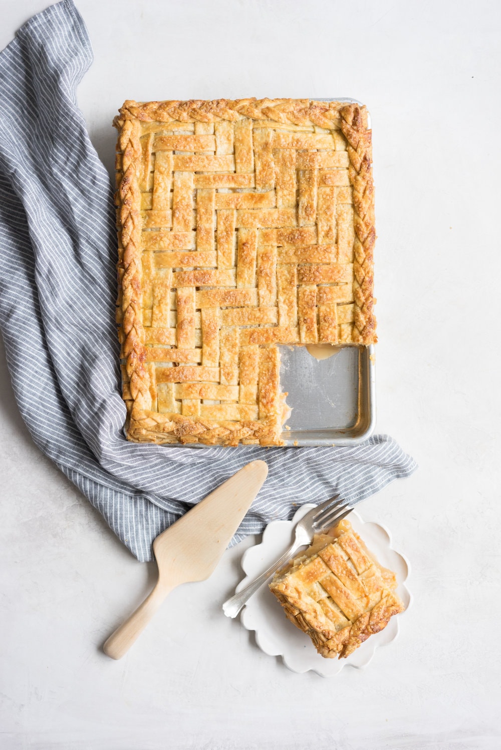 Apple Slab pie - perfect for a crowd, this apple slab pie combines juicy apples and tender flaky pie crust into the perfect make-ahead dessert, perfect for any season