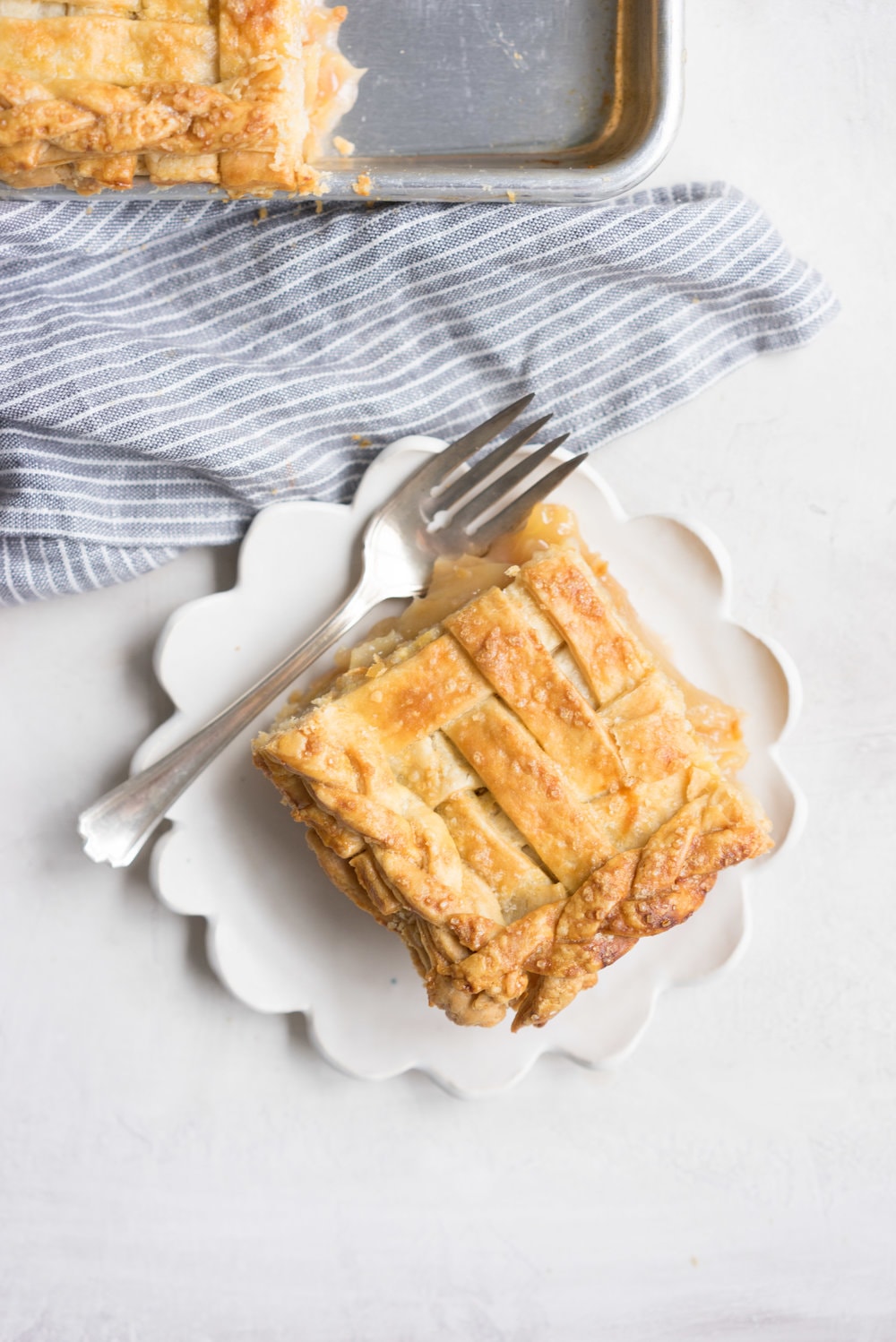 Apple Slab pie - perfect for a crowd, this apple slab pie combines juicy apples and tender flaky pie crust into the perfect make-ahead dessert, perfect for any season