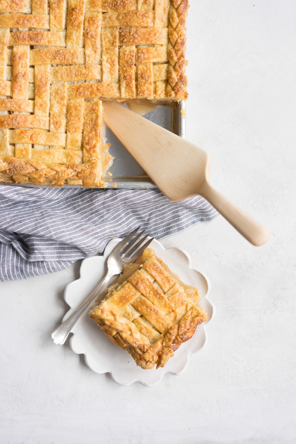 Apple Slab pie - perfect for a crowd, this apple slab pie combines juicy apples and tender flaky pie crust into the perfect make-ahead dessert, perfect for any season