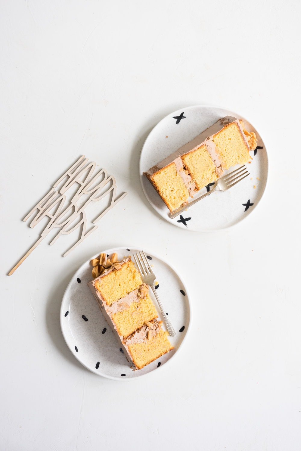 Peanut Butter Cake with Dark Chocolate Swiss Meringue Buttercream and Peanut Butter Crunch #cake #peanut butter