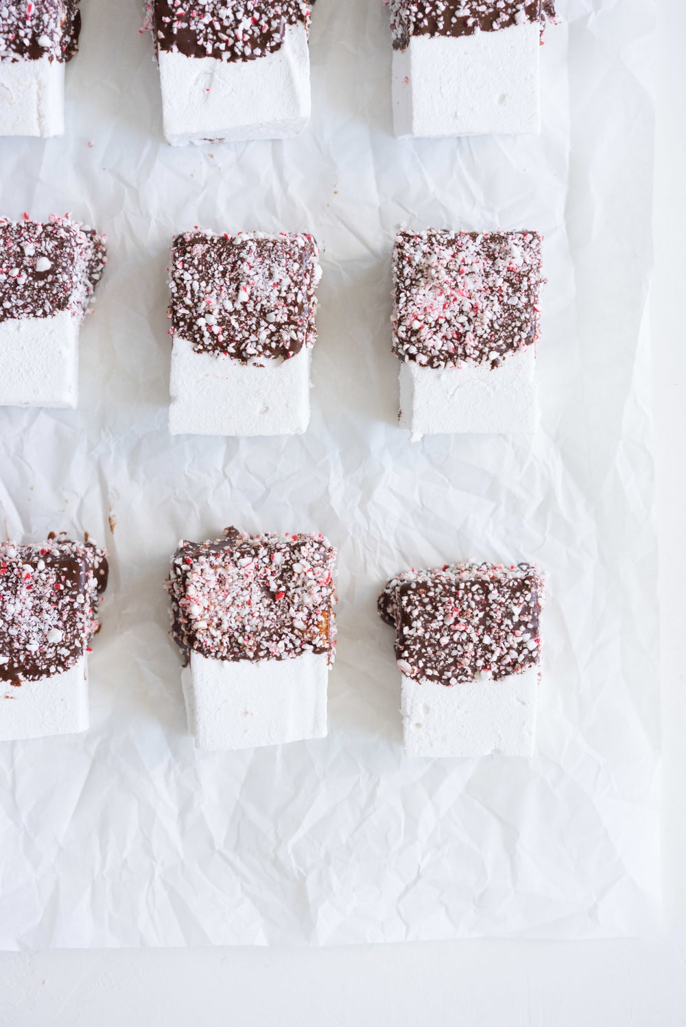 Peppermint S'mores with Chocolate Graham Crackers from Cloudy Kitchen. Puffy peppermint marshmallows are dipped in chocolate and rolled in candy canes, before being sandwiched between two chocolate graham crackers. A christmas twist on a holiday favourite