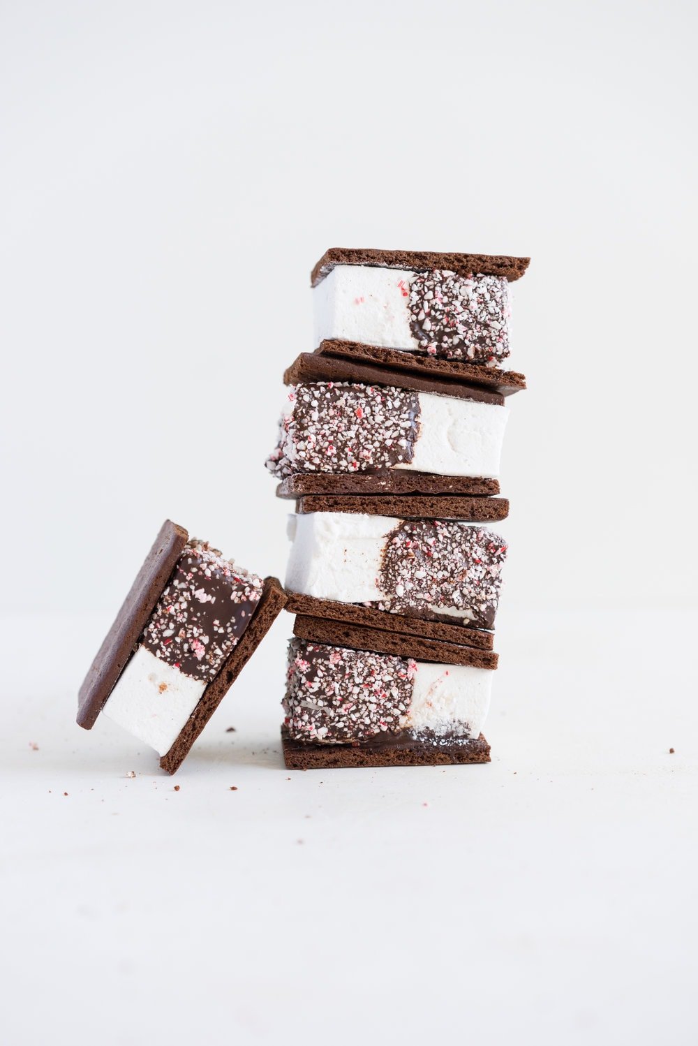 Peppermint S'mores with Chocolate Graham Crackers from Cloudy Kitchen. Puffy peppermint marshmallows are dipped in chocolate and rolled in candy canes, before being sandwiched between two chocolate graham crackers. A christmas twist on a holiday favourite