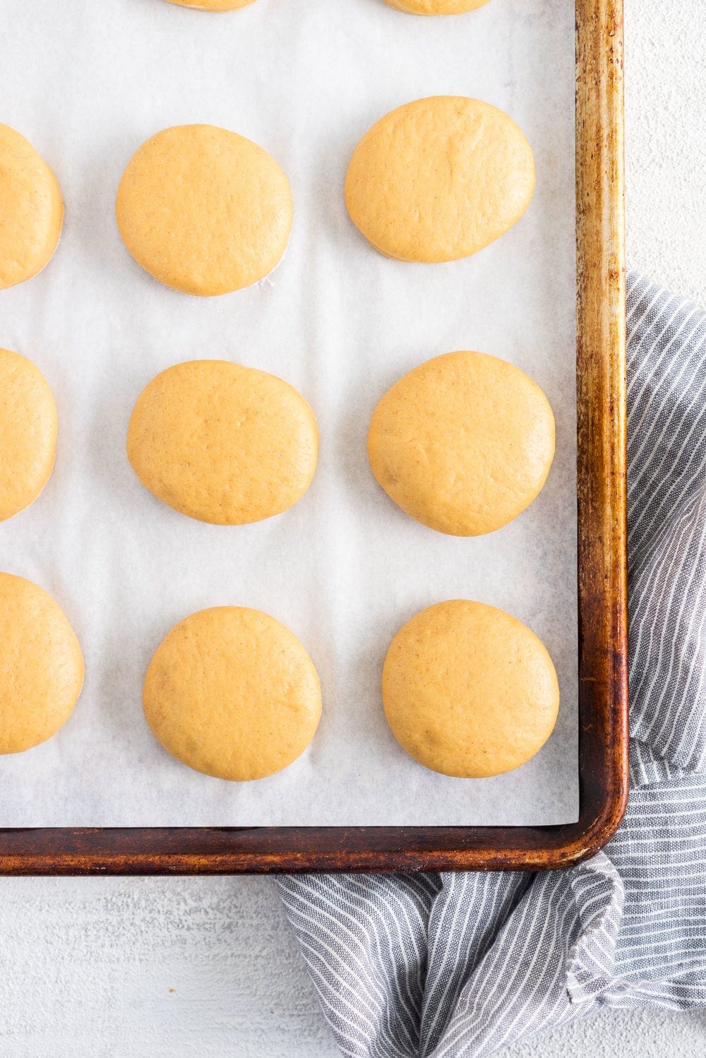 Gingerbread doughnuts with a spiced brown sugar diplomat cream. Pillowy brioche dough, spiced lightly with ginger and molasses, are stuffed with a light and creamy filling which is loaded with christmas spice. A perfect little package of holiday cheer