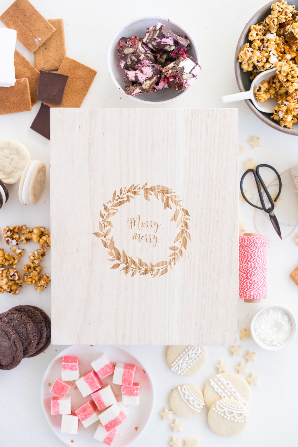 THE ultimate holiday cookie box - with something for everyone. Coconut ice, Honey Caramel Corn, sugar cookie marshmallow sandwiches, marshmallow and sugar cookie rocky road, piped roll out sugar cookies, and a DIY S'mores kit. What more could you wish for - this would be the perfect gift this holiday season.